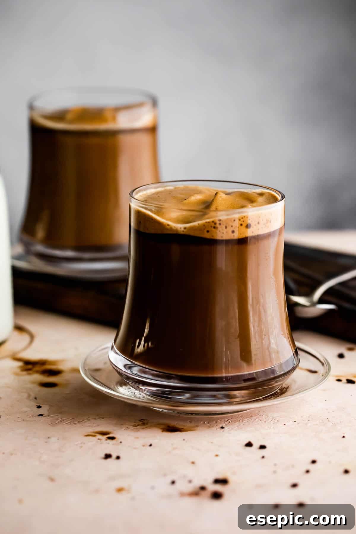 Image of two glass coffee mugs filled with Caffe Macchiato.