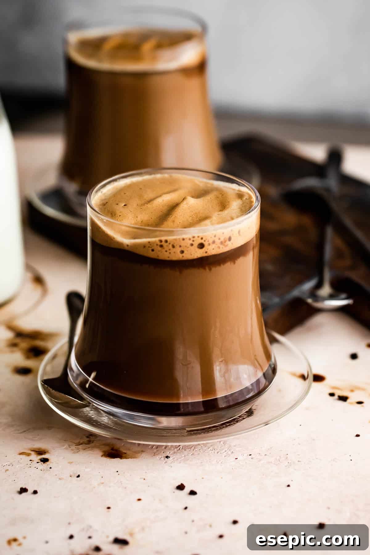 Image of two glass coffee mugs filled with Caffe Macchiato.