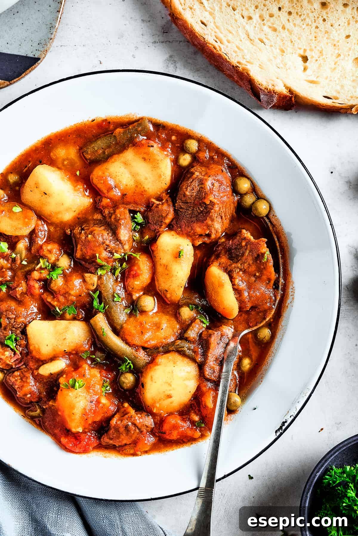 A Hearty Bowl of Mulligan Stew Overhead shot of a rustic bowl filled with rich Mulligan stew and mixed vegetables.
