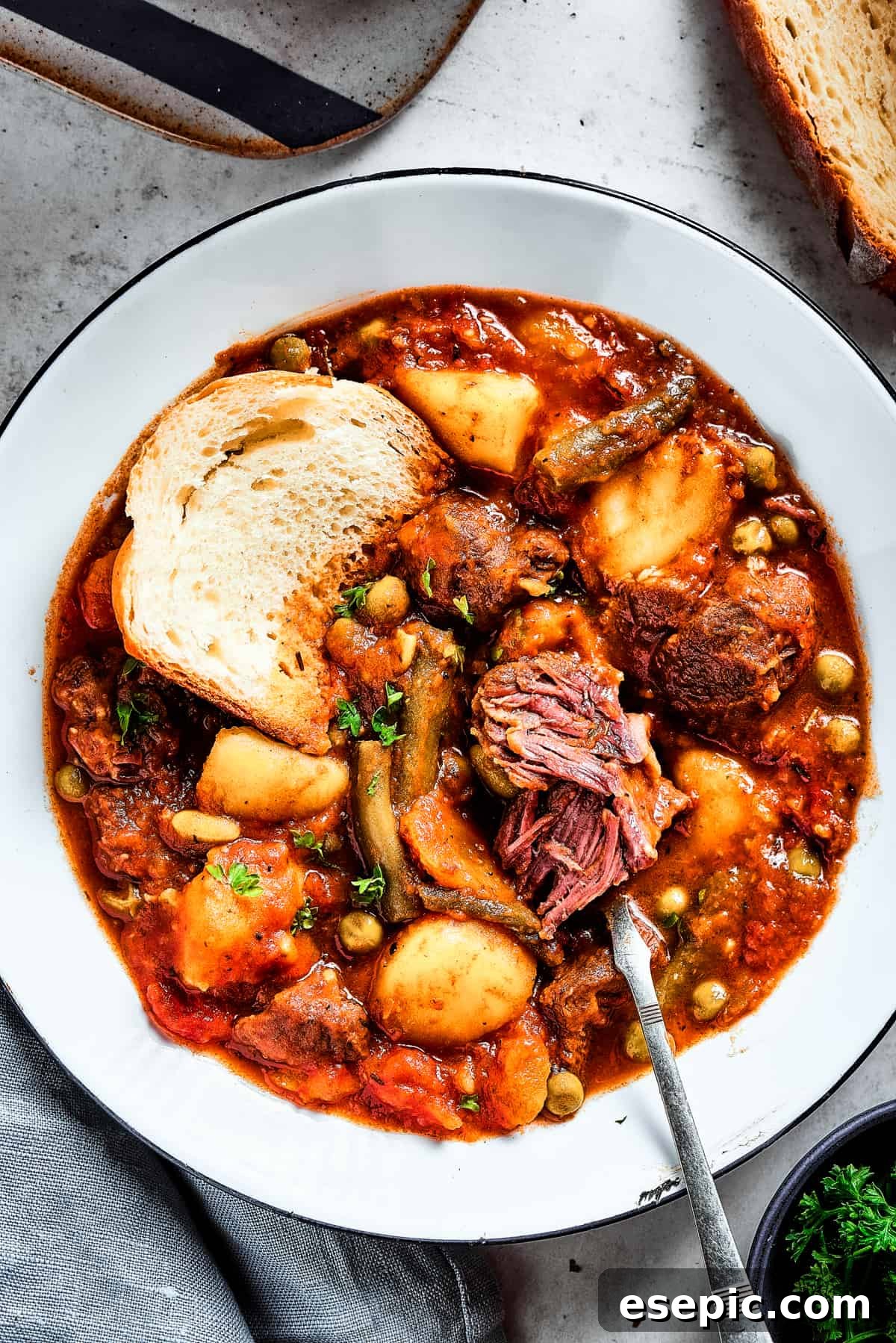 Flavorful Mulligan Stew with Perfectly Cooked Beef Close-up of a bowl of Mulligan stew with a spoon, showing the tender texture of the beef.