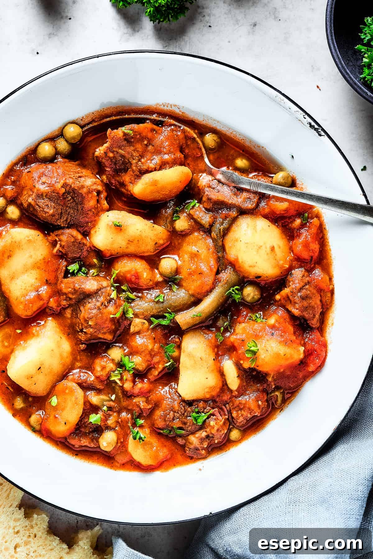 Delicious Overhead View of Mulligan Stew Overhead close-up shot of vibrant Mulligan stew, showcasing mixed vegetables and tender beef.