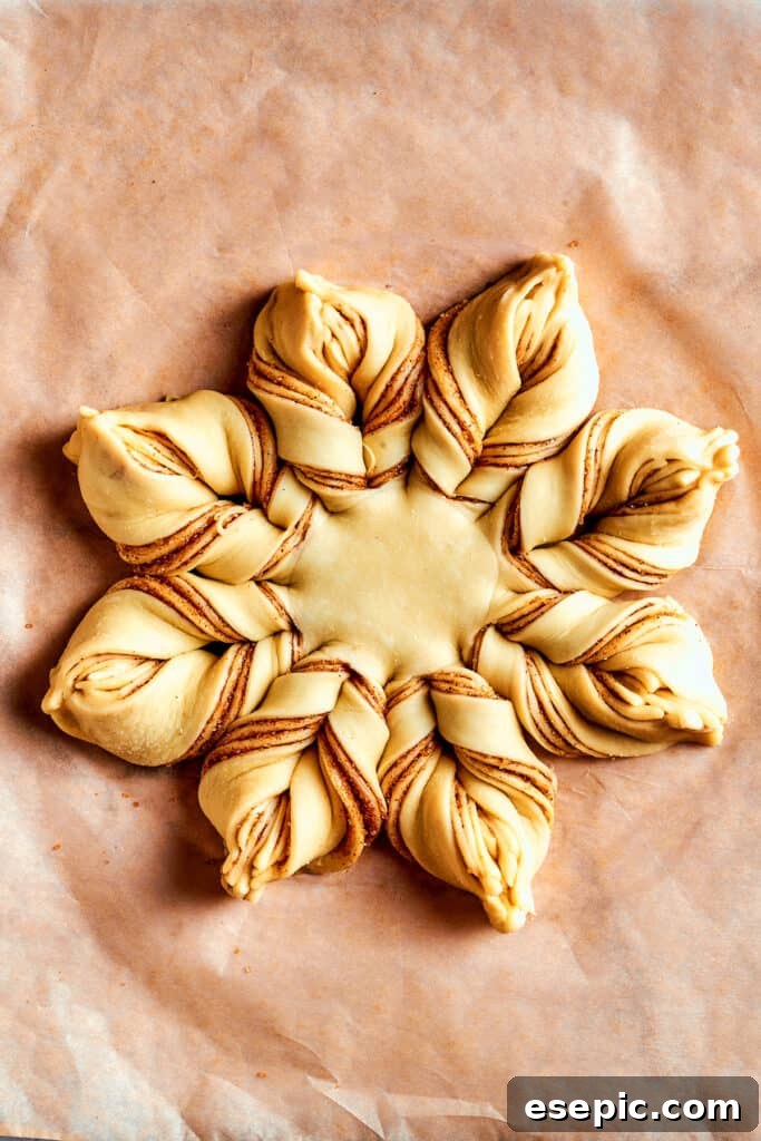 Overhead view of a fully assembled star bread before being baked.