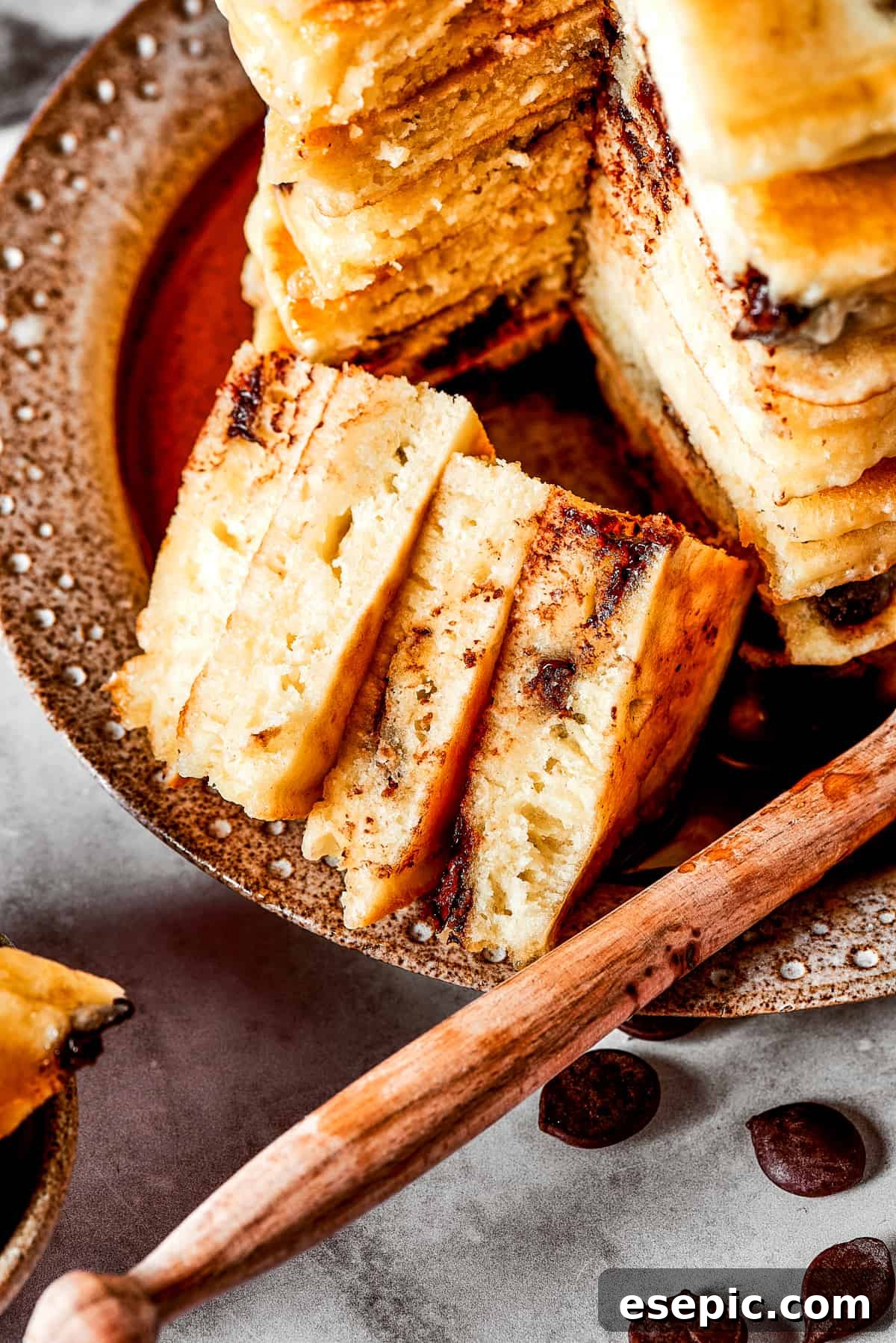 Close up of a bite of chocolate chip pancakes.