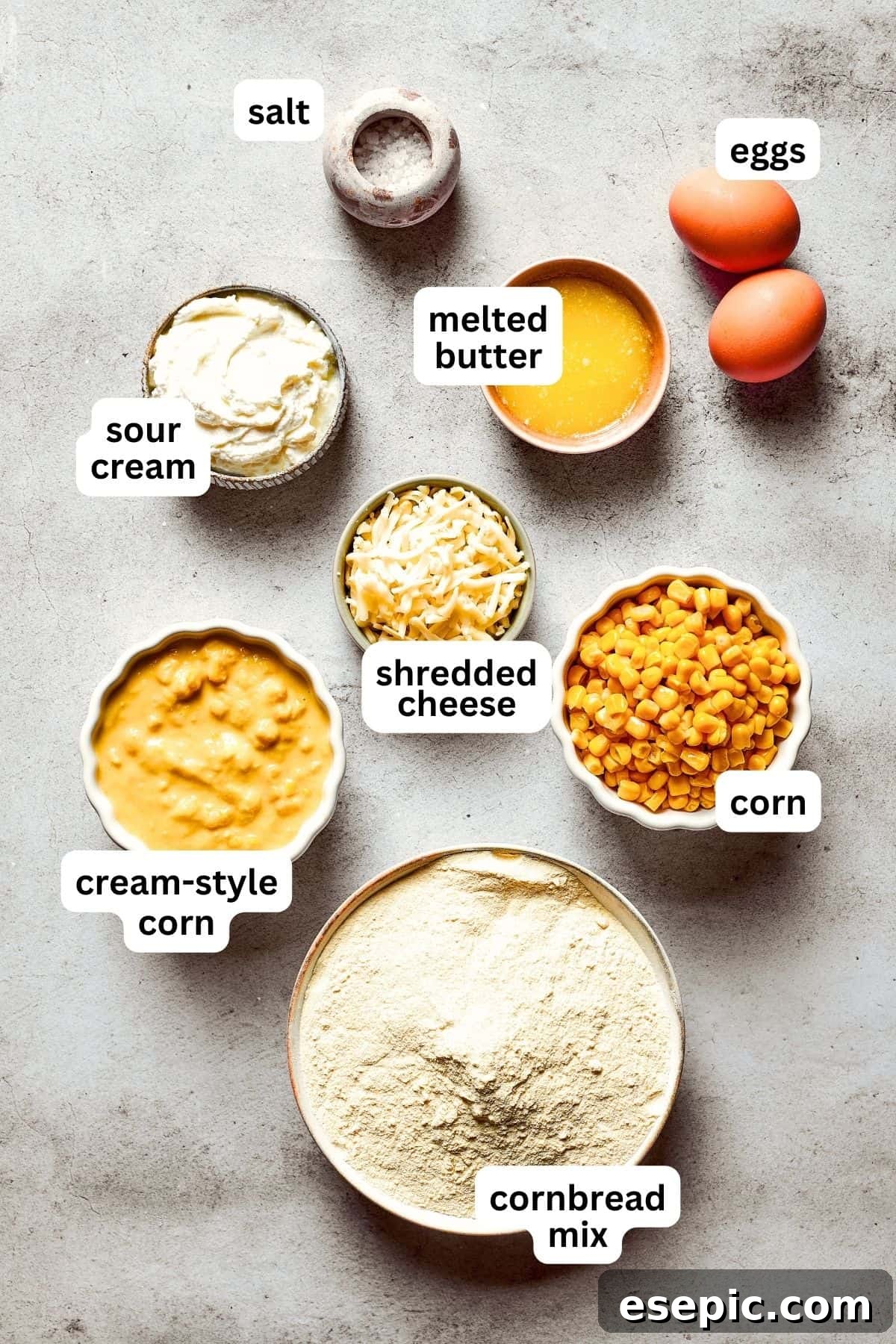 An overhead image of the fresh and canned ingredients used for making a delicious Corn Souffle.