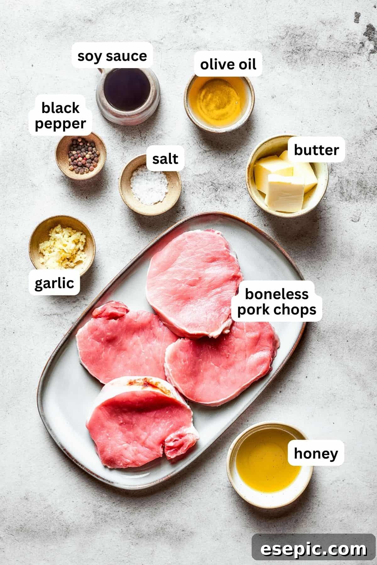 These Honey Garlic Pork Chops are the perfect blend of sweet-salty with a punch of extra flavor from minced garlic. Ready in 20 minutes! Overhead view of all the ingredients used to make honey garlic pork chops.
