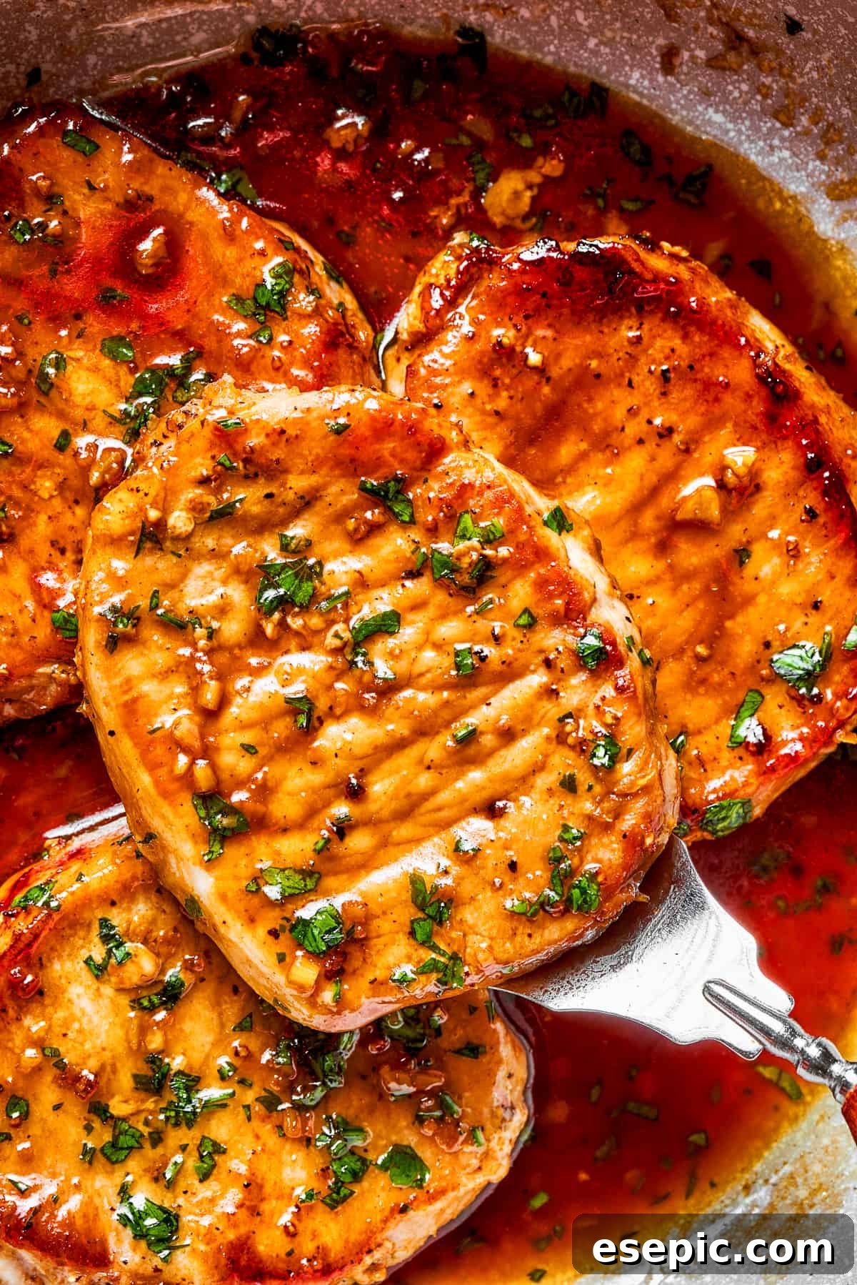 These Honey Garlic Pork Chops are the perfect blend of sweet-salty with a punch of extra flavor from minced garlic. Ready in 20 minutes! Up close honey garlic pork chops.