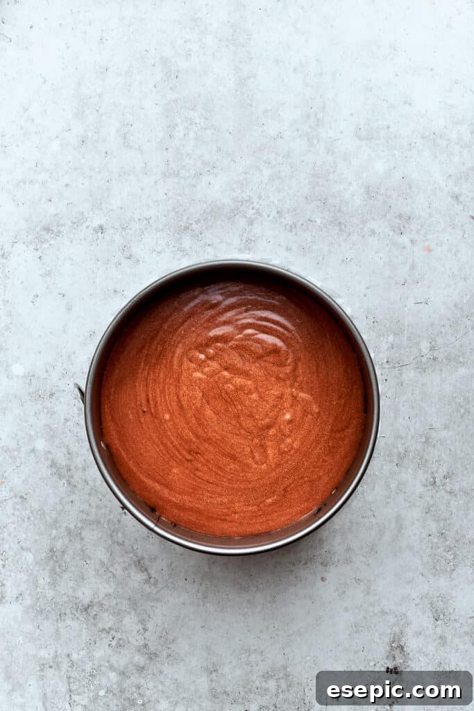 The chocolate cheesecake filling layer tops the caramel-pecan layer.