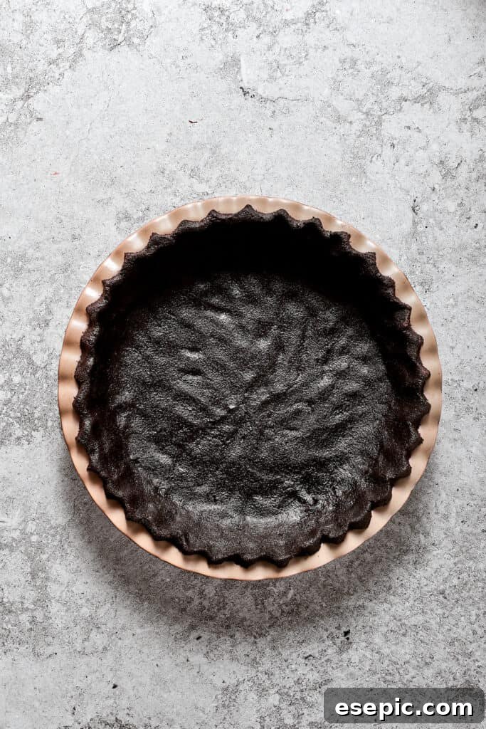 Decadent Chocolate Silk Dream 2 The prepared Oreo cookie crust, firmly pressed into a pie pan, awaiting its luxurious filling.