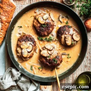Four pieces of chopped steak are added to a pan with gravy.