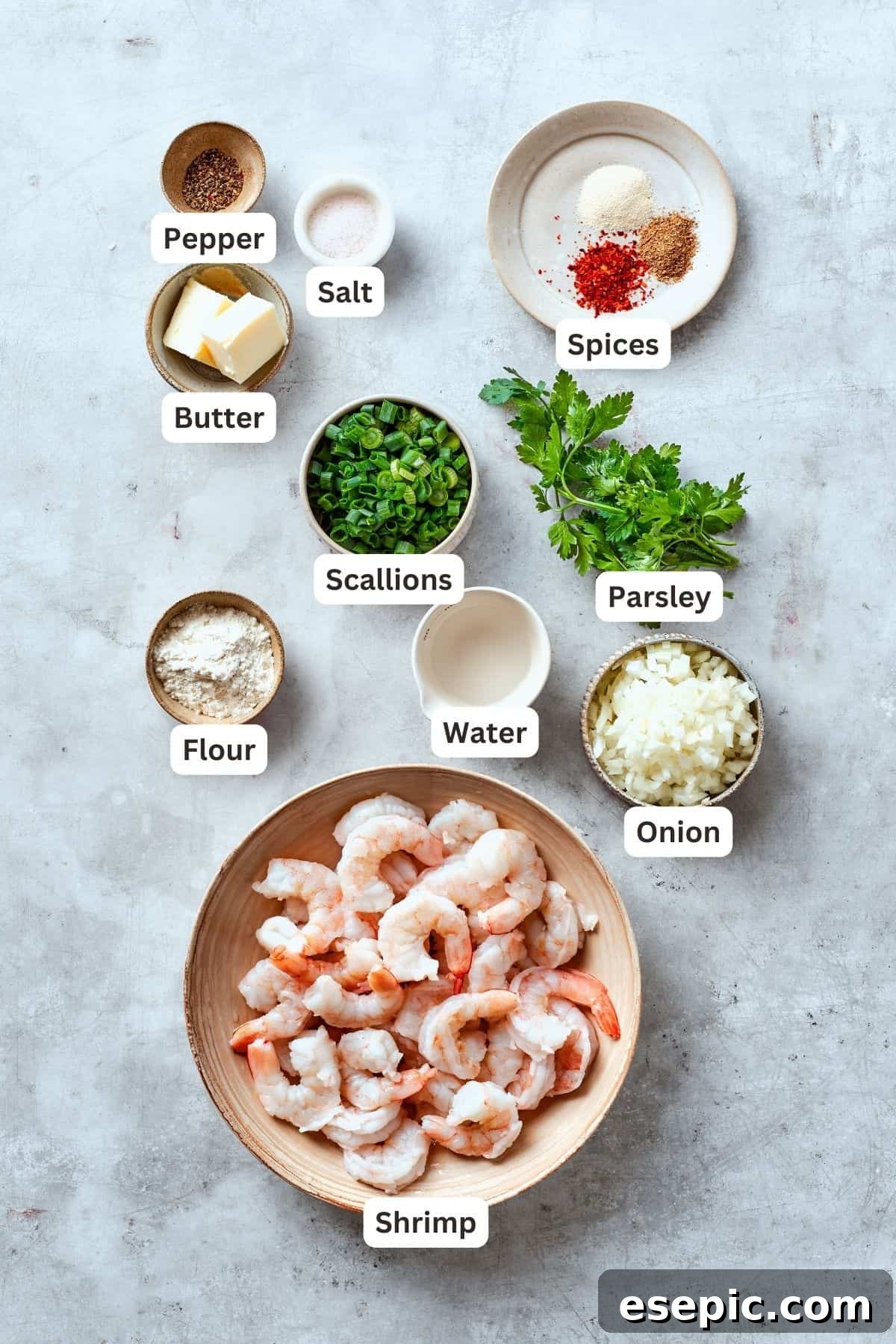 The ingredients for shrimp burgers are clearly labelled: butter, pepper, salt, flour, spices, parsley, onion, water, scallions, shrimp, ready for preparation.