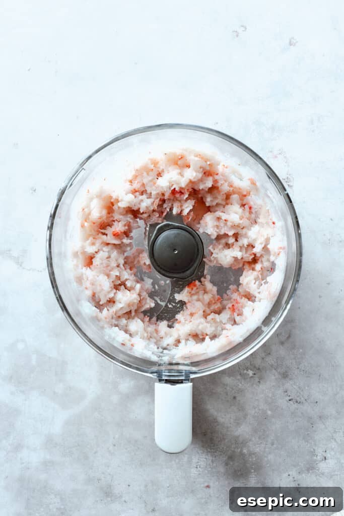 The process of preparing the shrimp mixture, showing shrimp being processed in a food processor to achieve the desired texture.