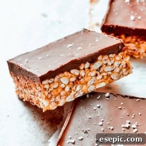Chewy Peanut Butter Rice Crispy Squares 2 A square bar of rice krispies topped with a layer of melted chocolate.