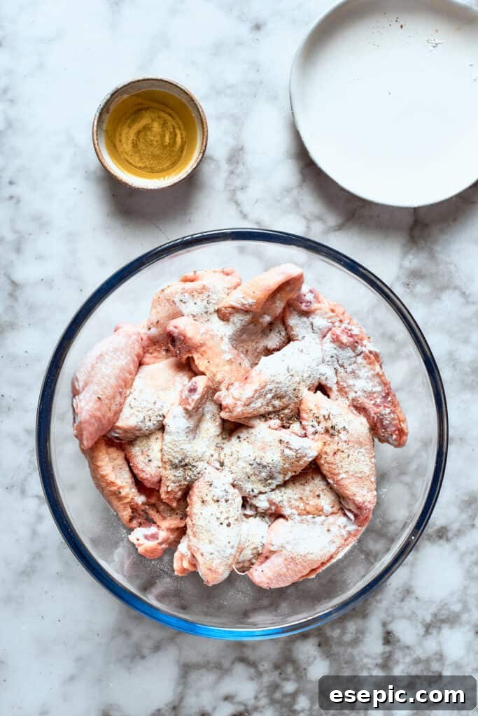 The chicken is mixed with flour.