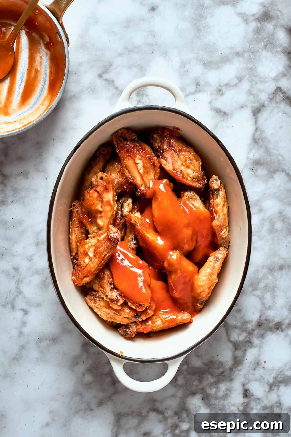 The wings are topped with sauce.