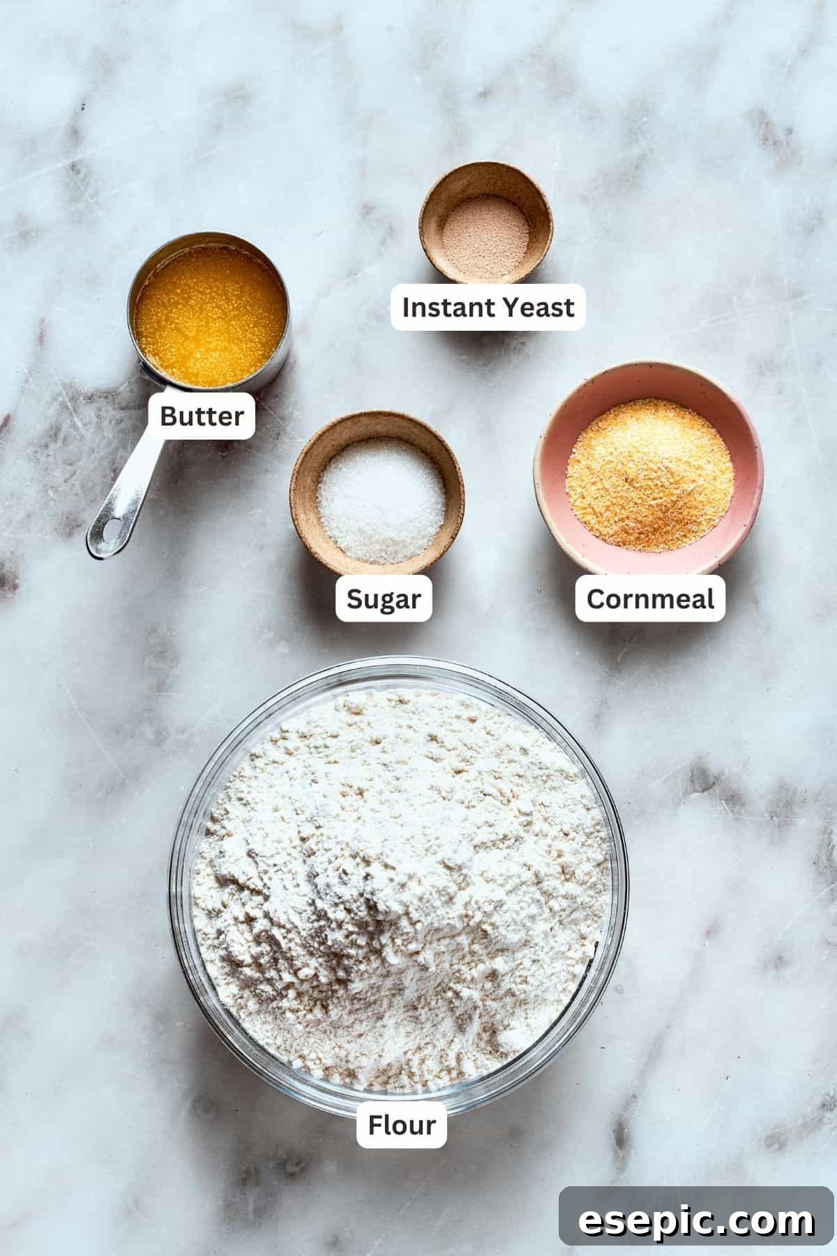 Deep dish pizza crust ingredients: flour, cornmeal, butter, sugar, instant yeast, salt, water, olive oil.