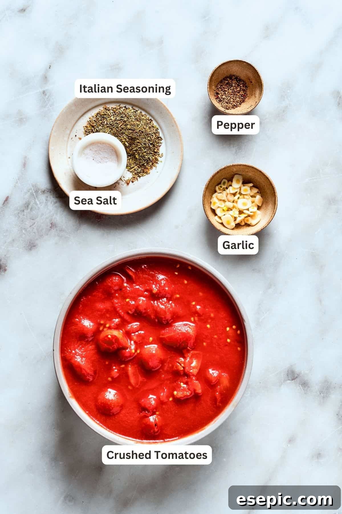 Deep dish pizza sauce ingredients: canned crushed tomatoes, fresh garlic, black pepper, Italian seasoning, sea salt.