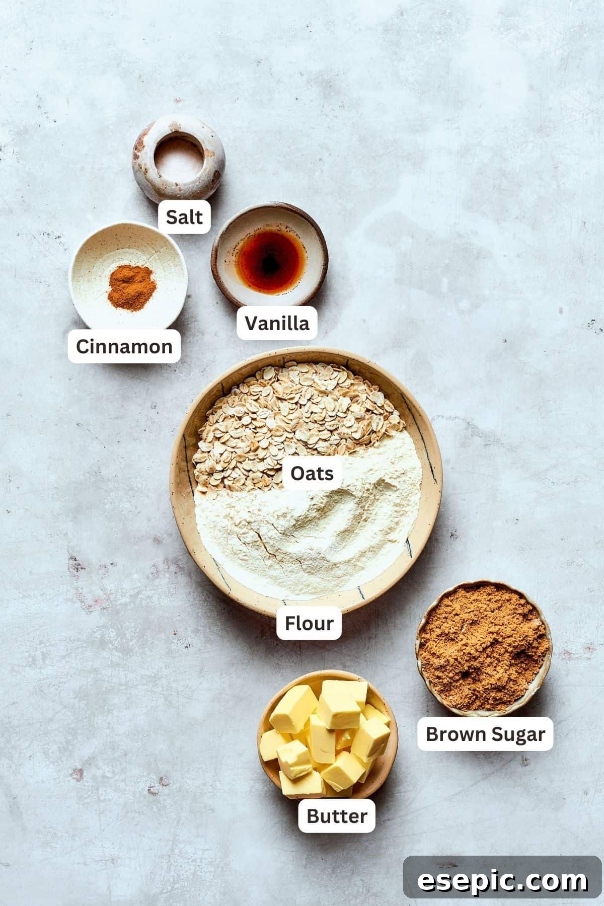 All the essentials for creating a delicious buttery brown sugar and oat crumble topping for your blueberry crisp. Labeled ingredients for blueberry crisp topping: cinnamon, vanilla extract, salt, all-purpose flour, old-fashioned oats, cold butter, and light brown sugar.