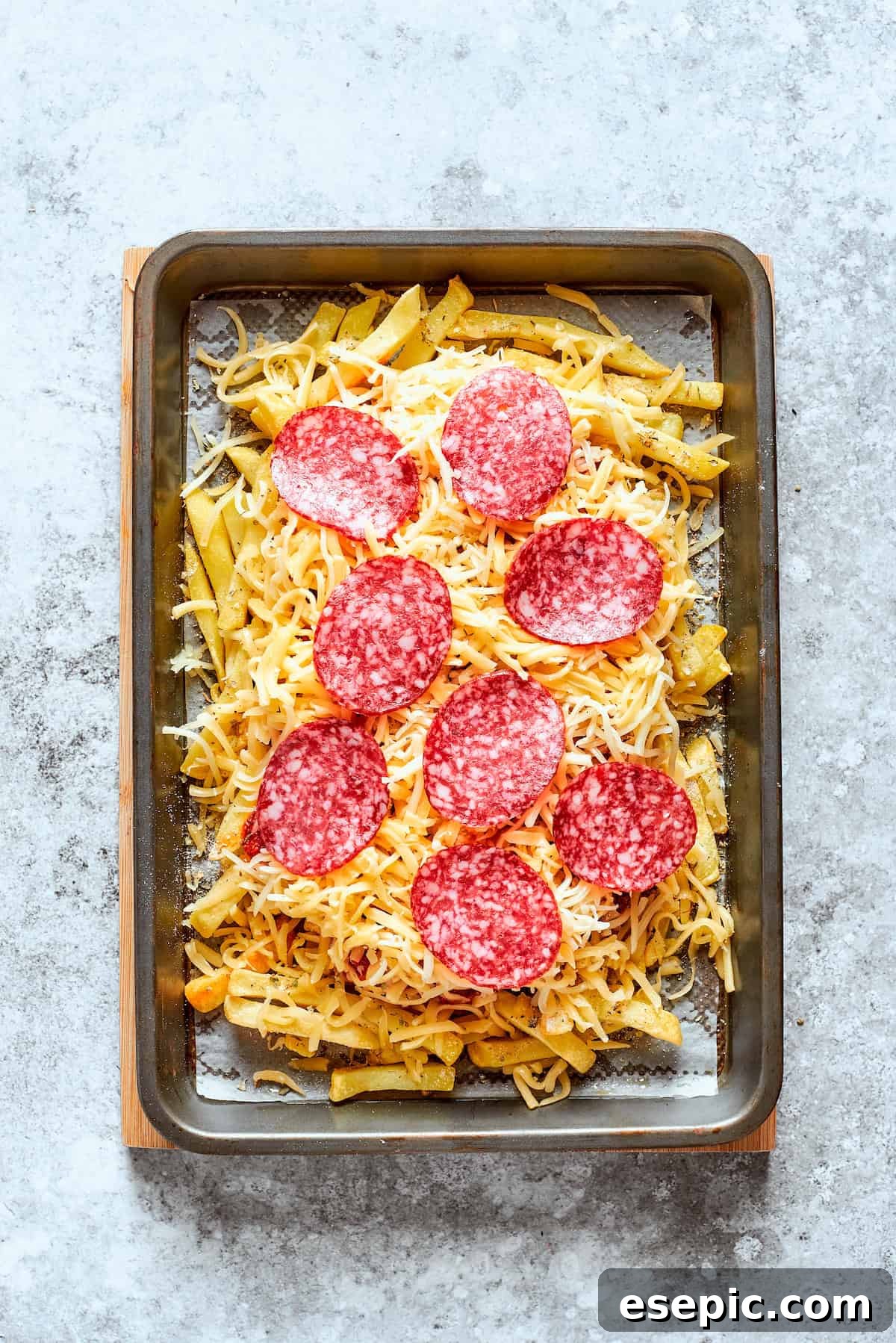 Pizza Fry Fusion 8 Pepperoni is placed on top of the cheese.