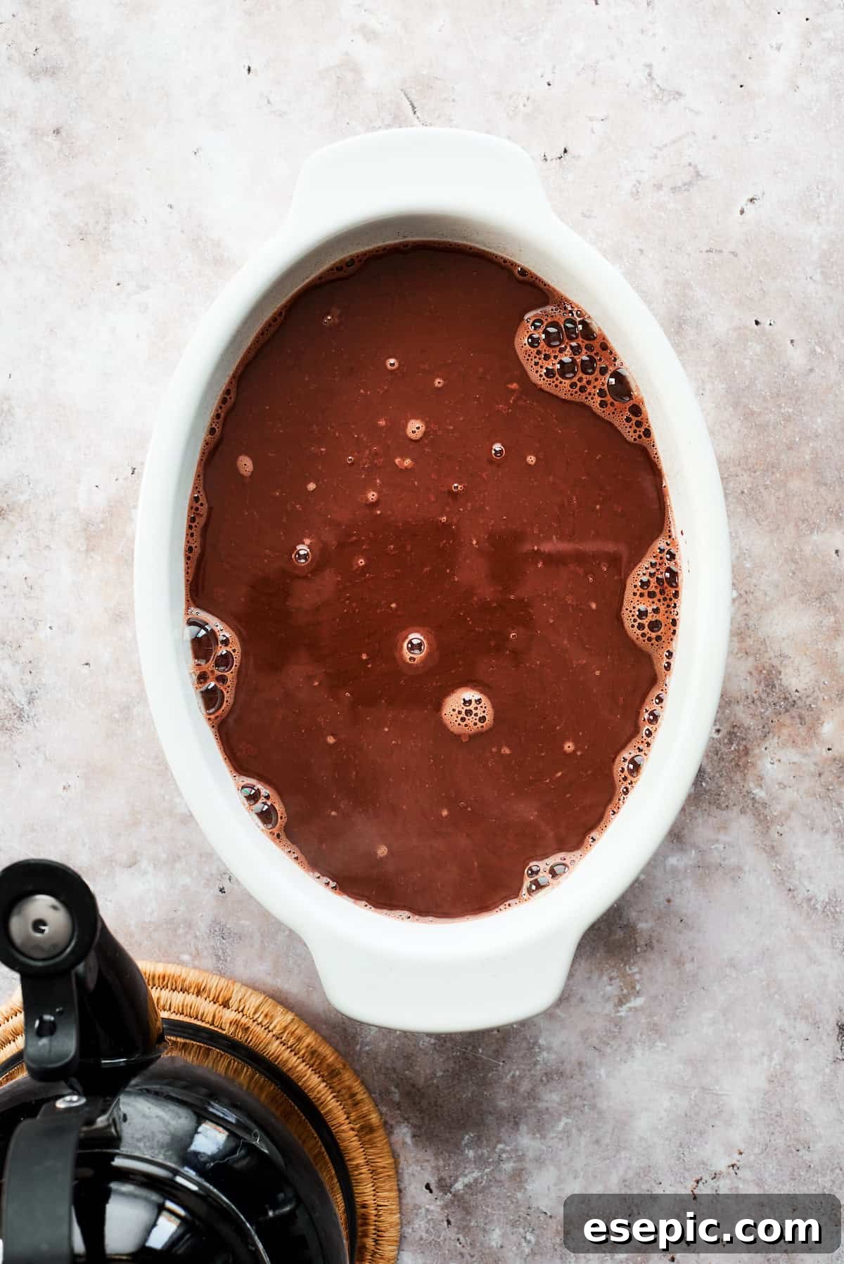 This moist and gooey Chocolate Pudding Cake is loaded with rich chocolate flavor in every bite. Best served warm! Boiling water is poured over the cake and topping in the pan.