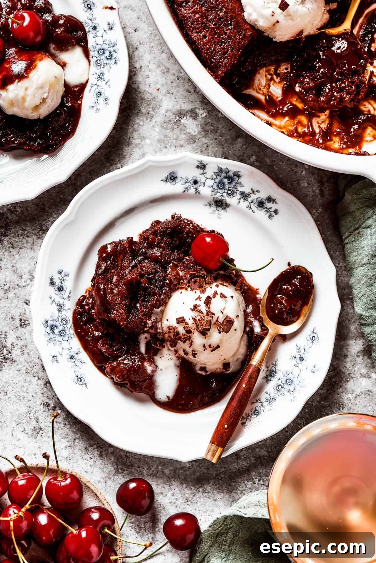 This moist and gooey Chocolate Pudding Cake is loaded with rich chocolate flavor in every bite. Best served warm! Pudding cake served on a dessert plate with a scoop of ice cream.