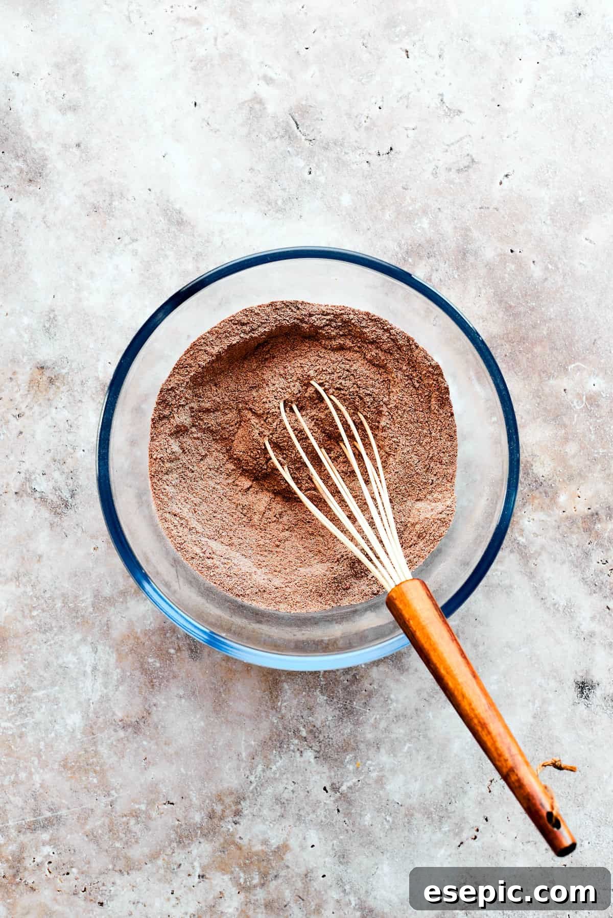 This moist and gooey Chocolate Pudding Cake is loaded with rich chocolate flavor in every bite. Best served warm! Dry ingredients for chocolate pudding cake are whisked.