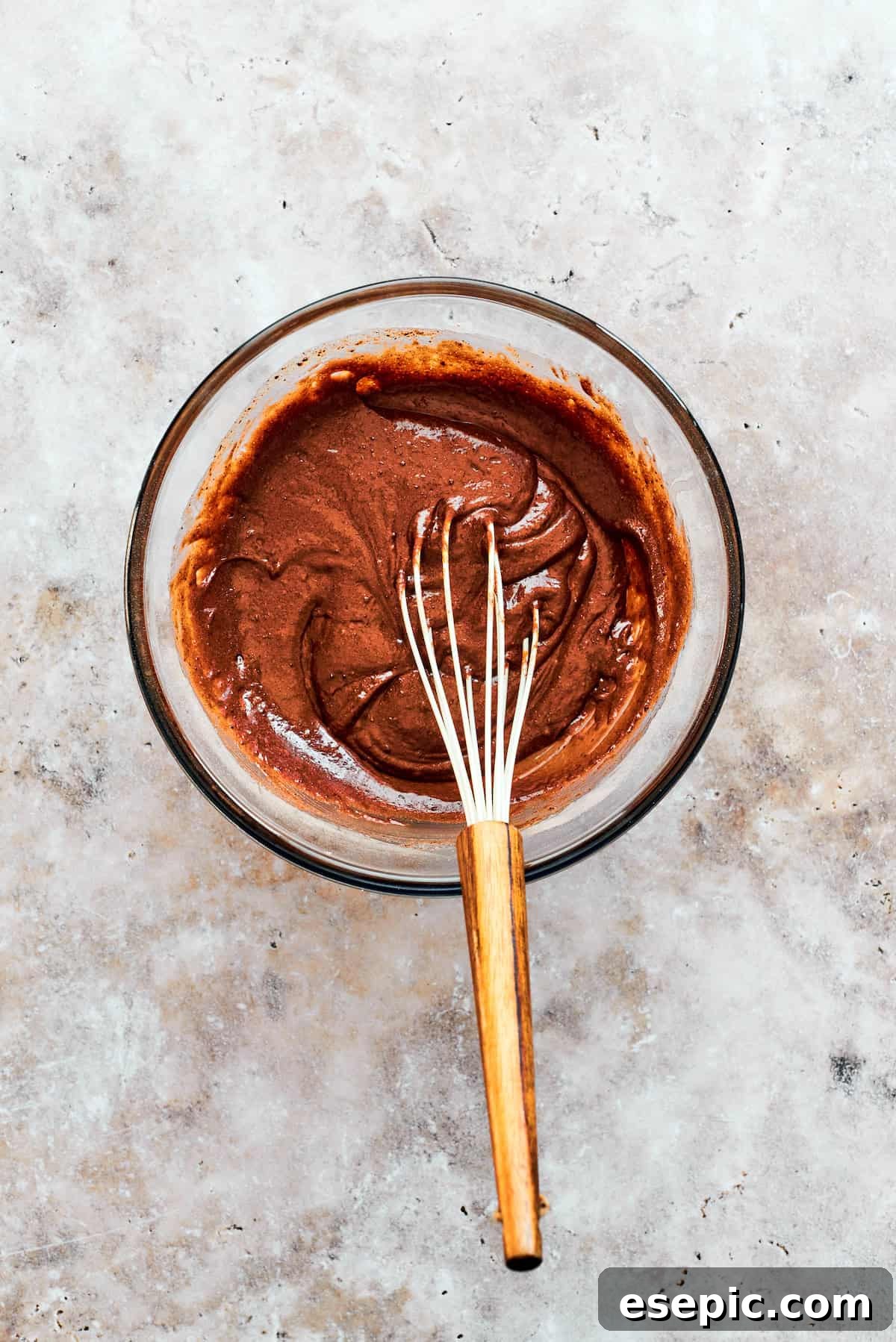 This moist and gooey Chocolate Pudding Cake is loaded with rich chocolate flavor in every bite. Best served warm! A whisk combines the cake batter.