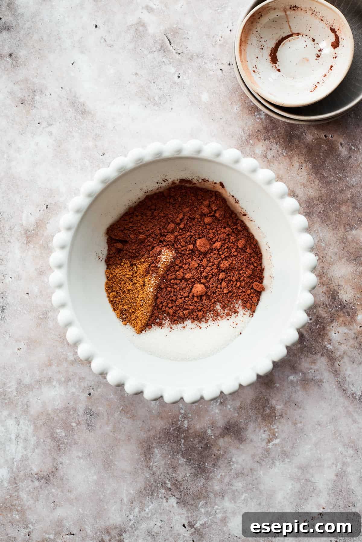 This moist and gooey Chocolate Pudding Cake is loaded with rich chocolate flavor in every bite. Best served warm! The fudge topping ingredients are added to a bowl.
