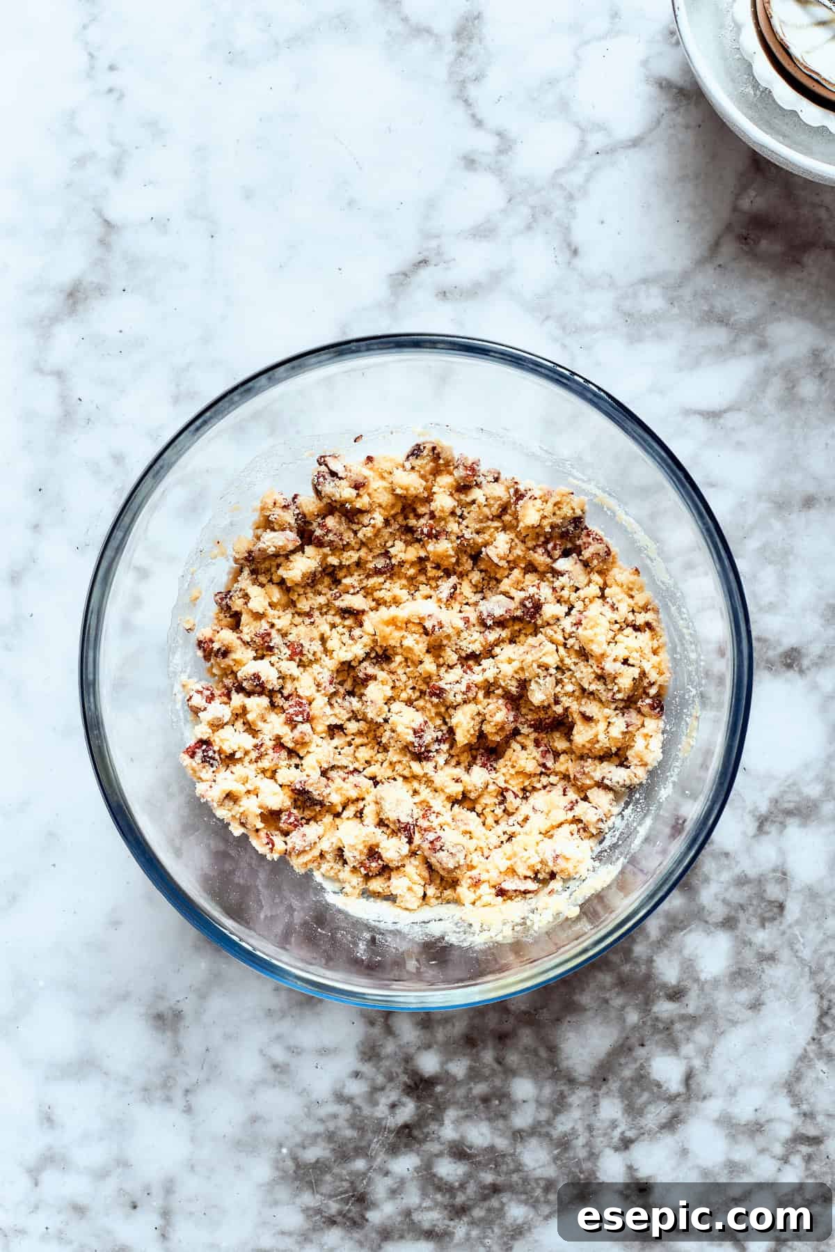 Crust ingredients are added to a glass bowl.
