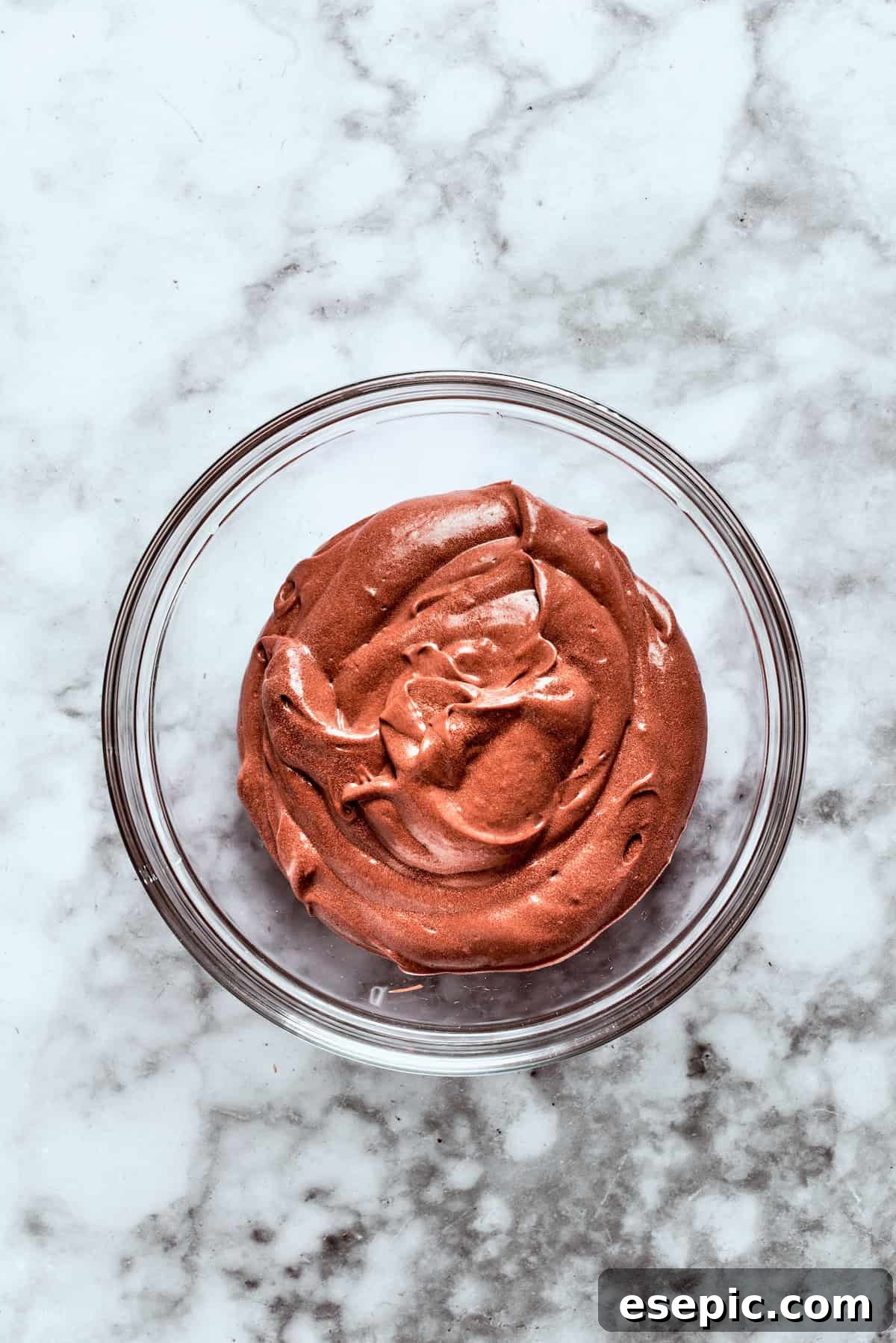Thick, rich chocolate pudding is ready after being whisked with milk.