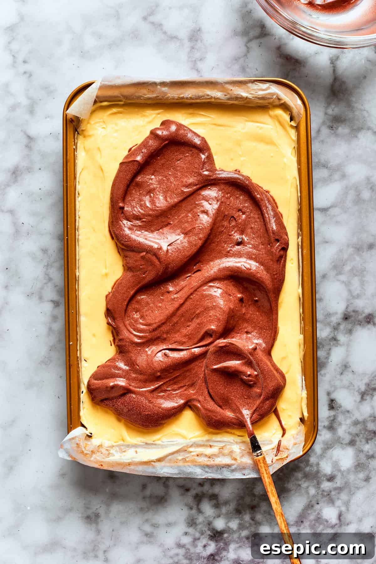 The chocolate pudding layer is added.