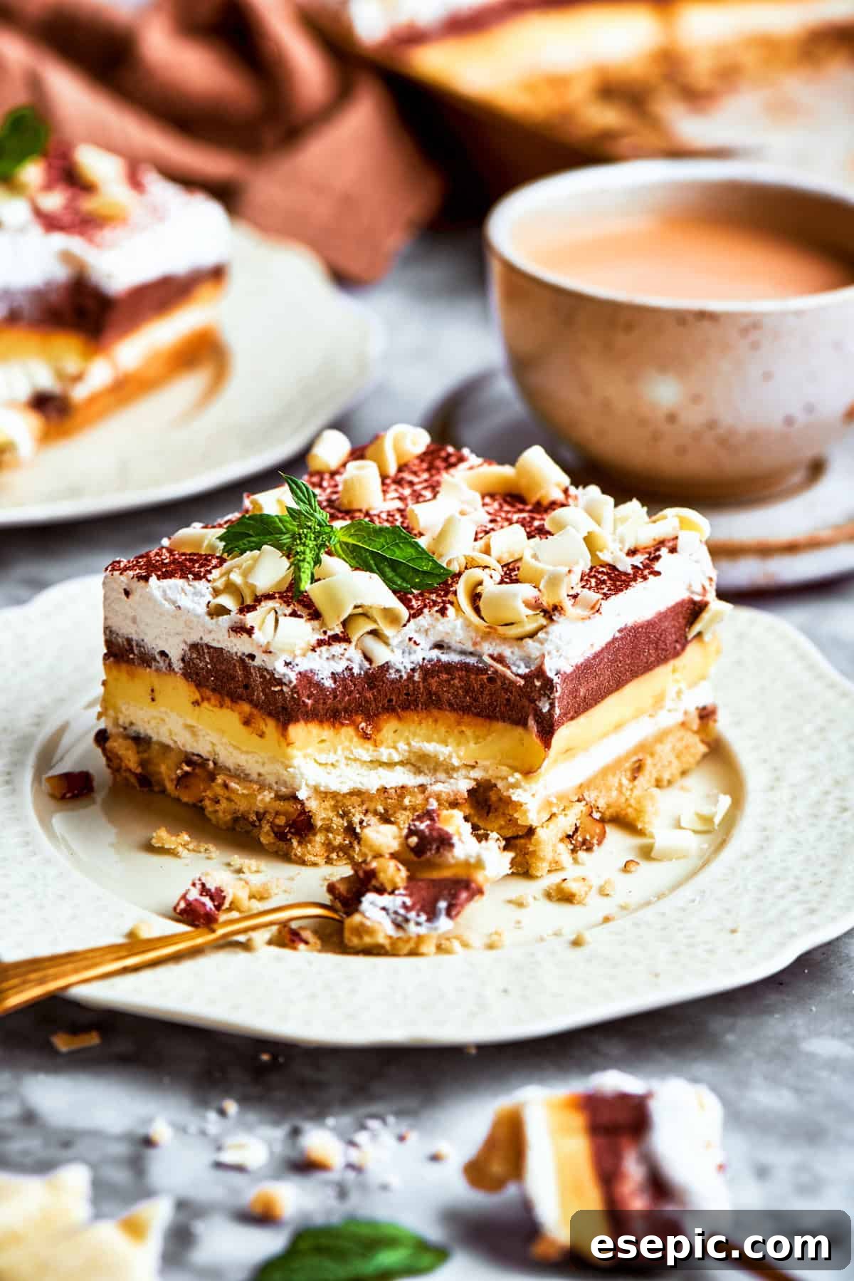 A freshly cut slice of Sex in a Pan dessert, showcasing the beautiful layers and delightful toppings, ready to be served.