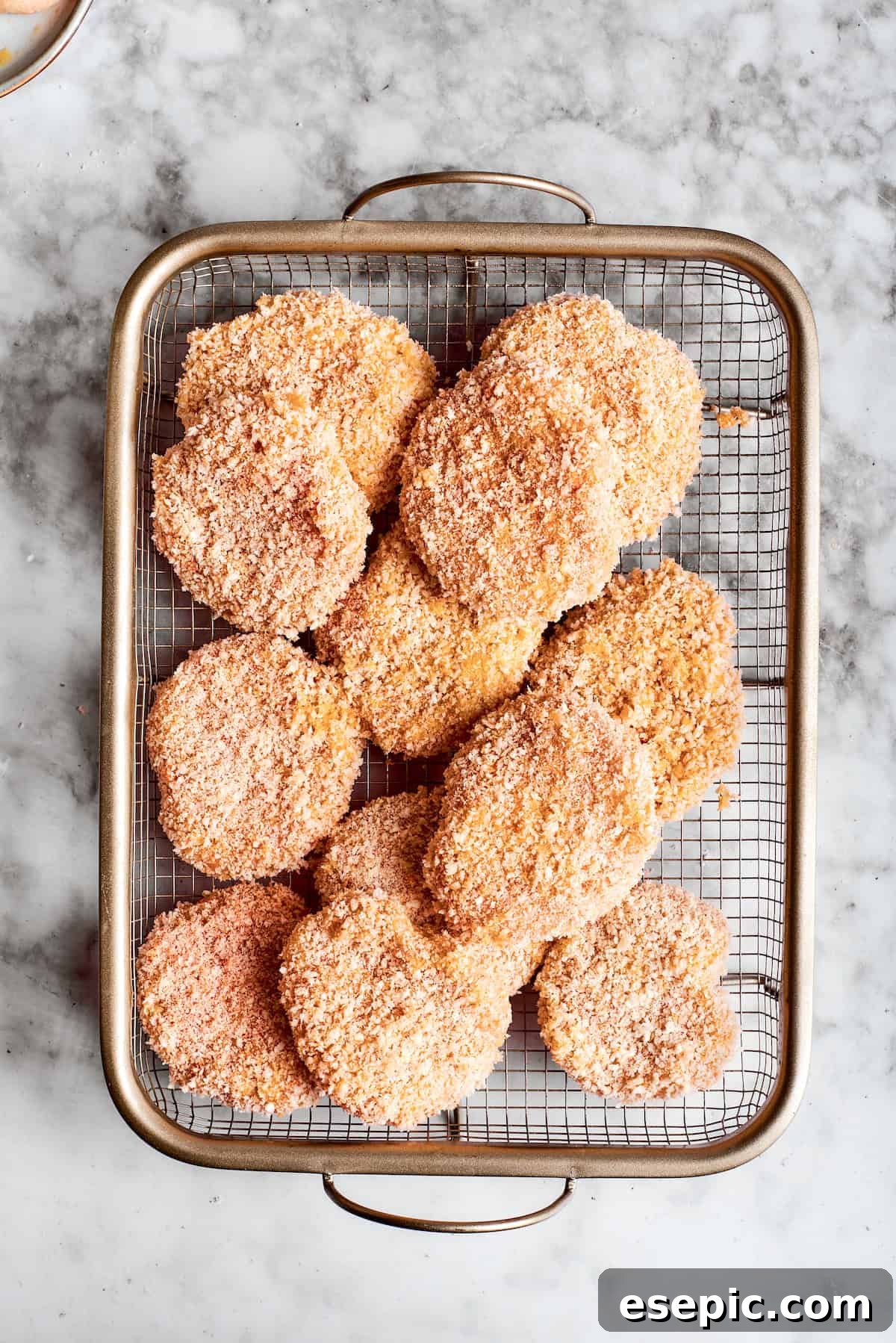 This easy homemade Chicken Nuggets Recipe features perfectly cooked homemade chicken nuggets that are crispy outside and juicy on the inside. Chicken nuggets in a basket.