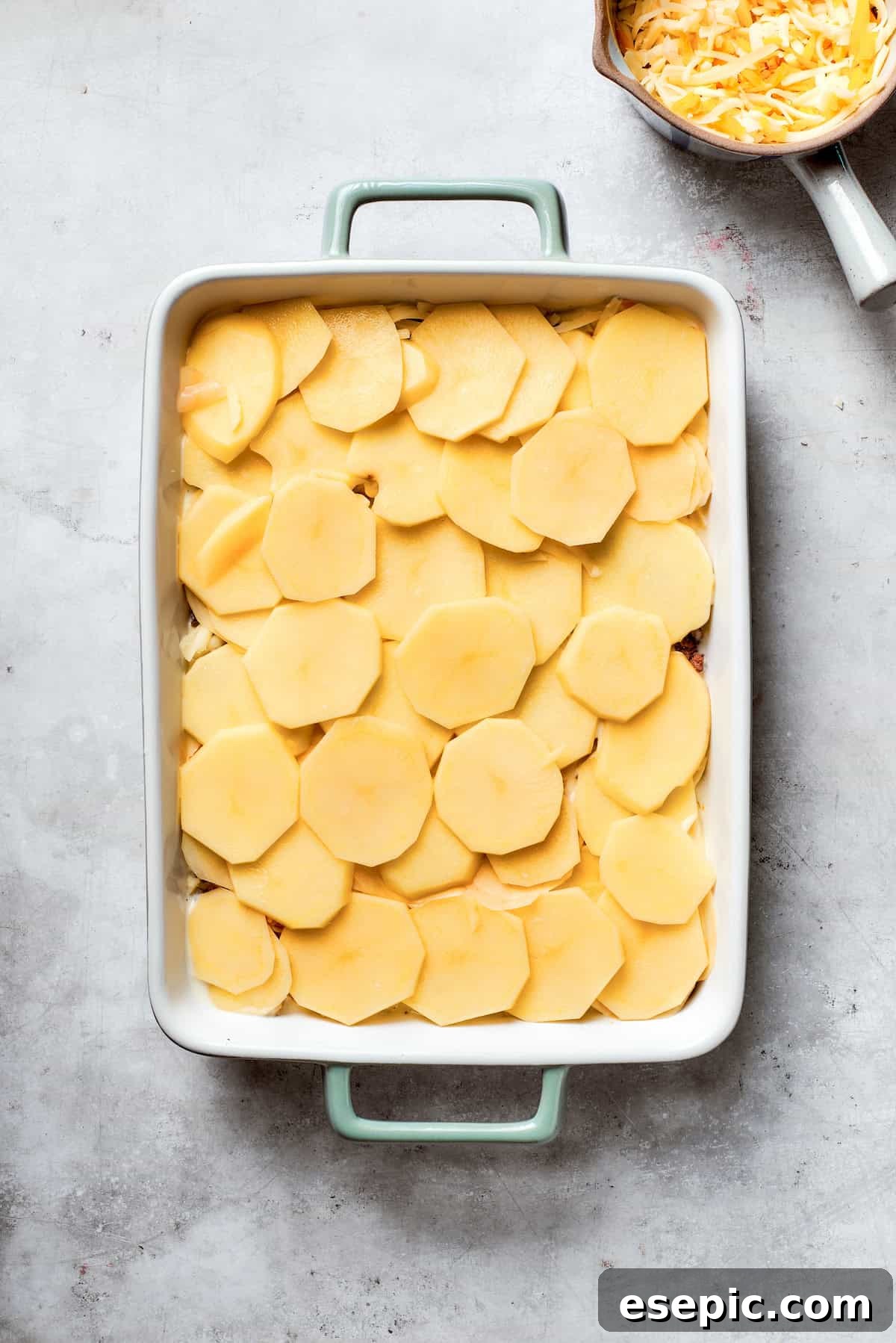 Sliced potatoes are added.
