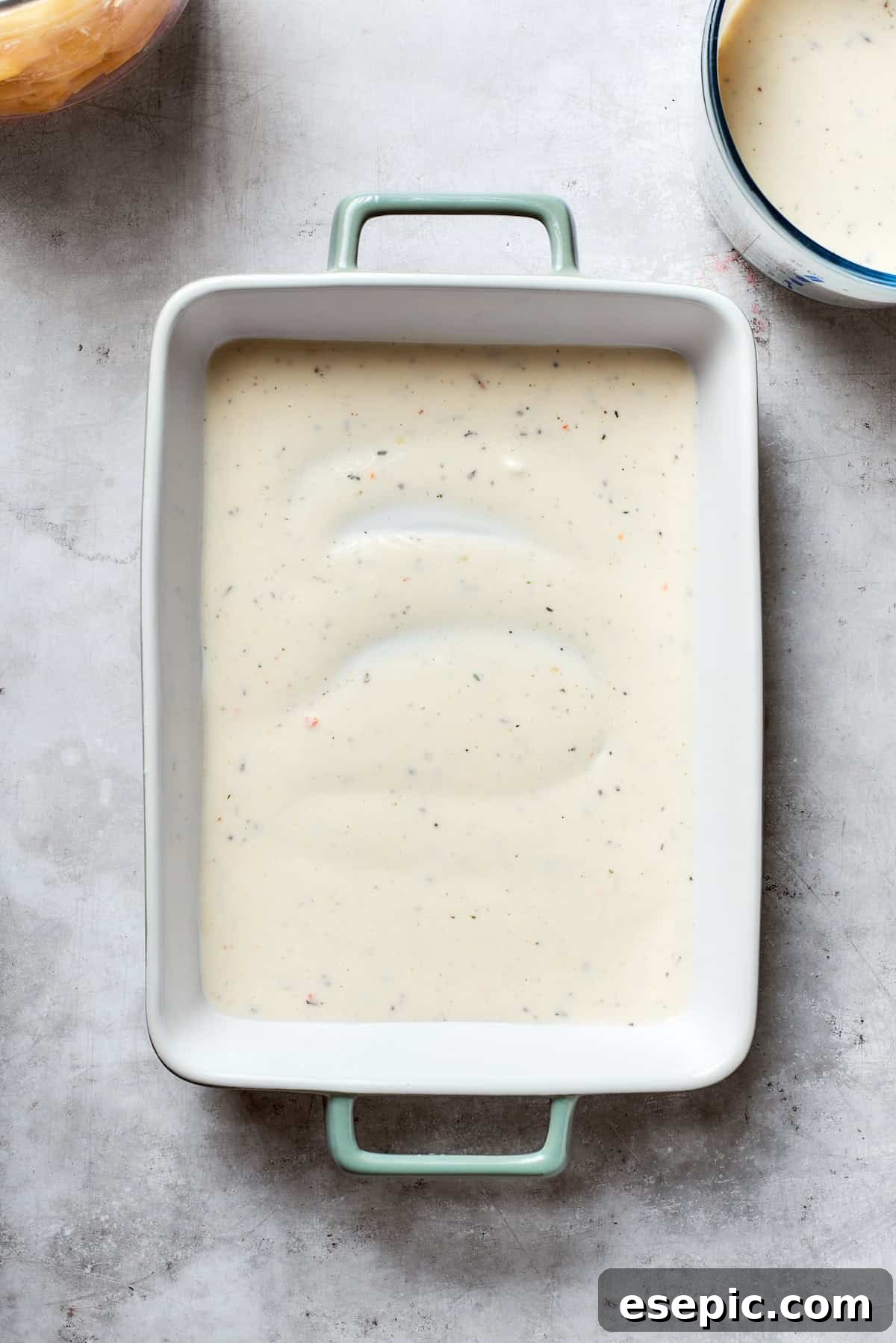 Mushroom soup is added to the bottom of the pan.