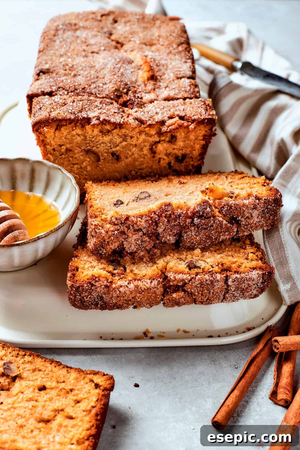 Slices of Amish friendship bread are buttered on a plate.