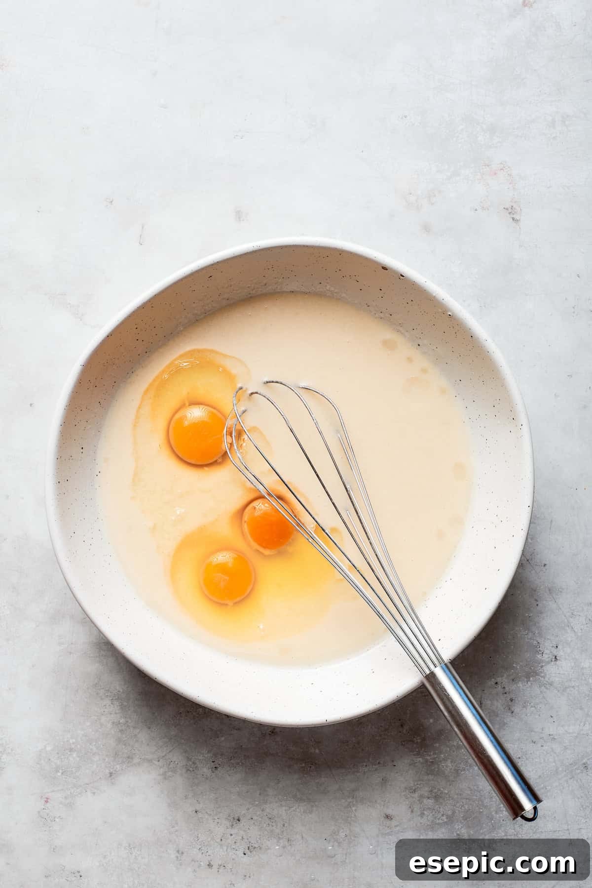 Eggs are added to the batter of Amish friendship bread.