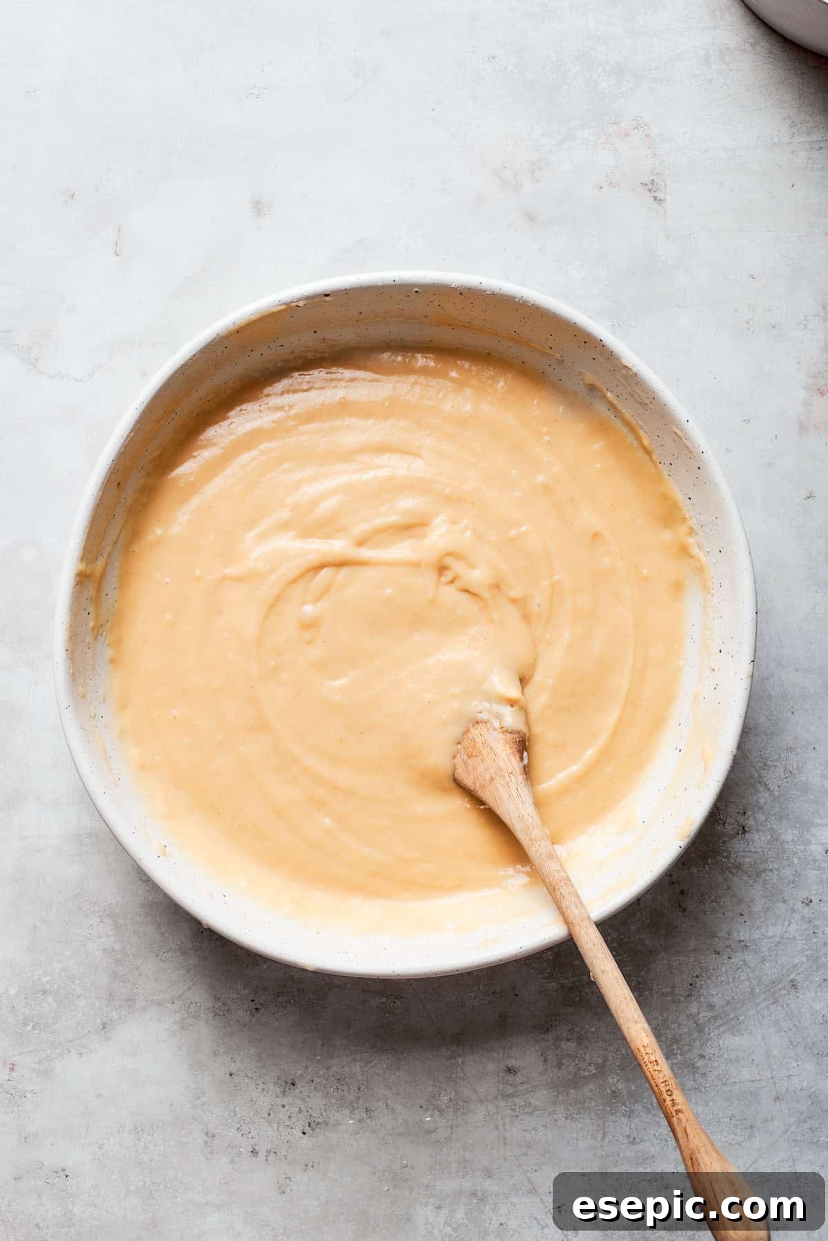 The batter is stirred until smooth.
