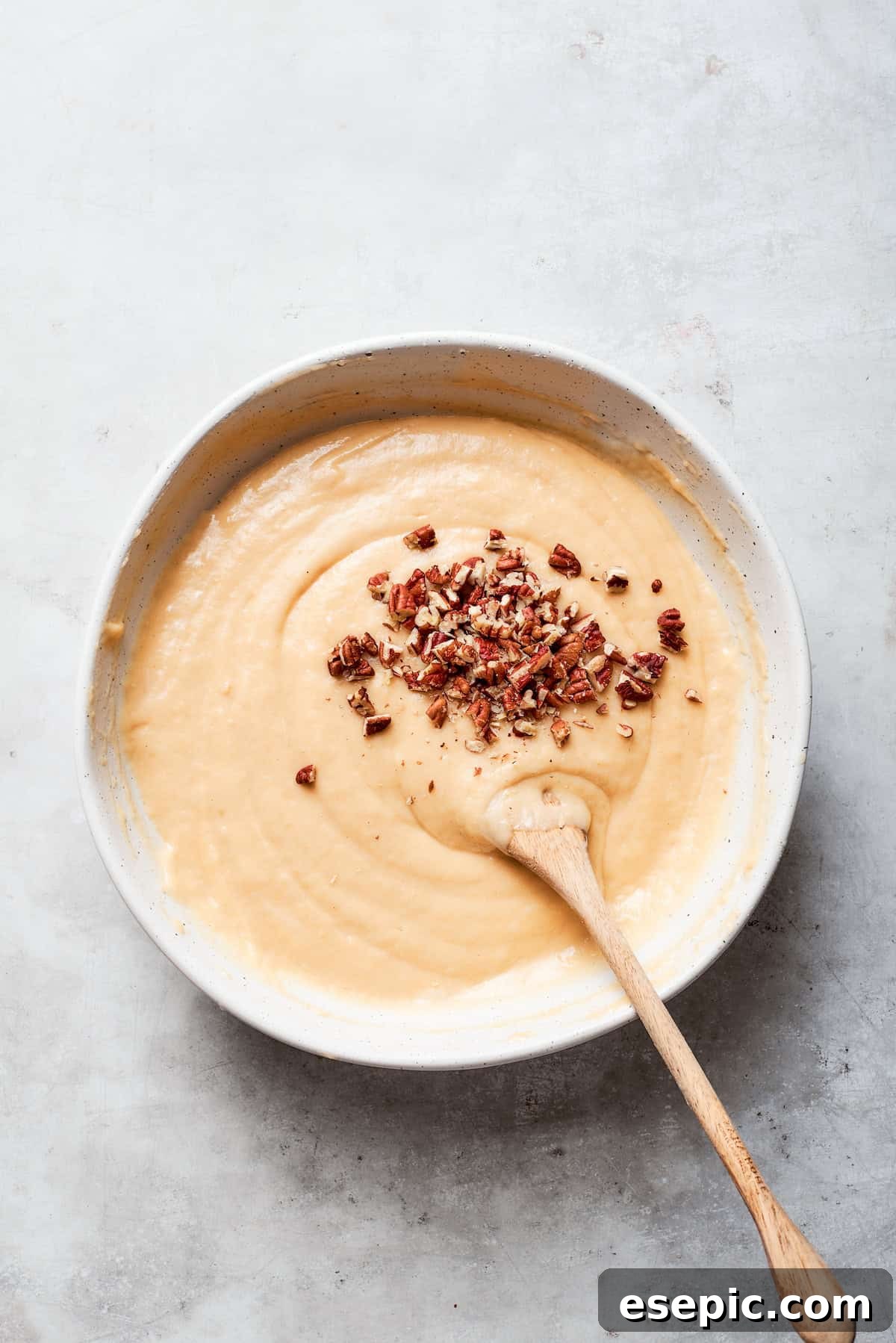 Nuts are stirred into the batter.