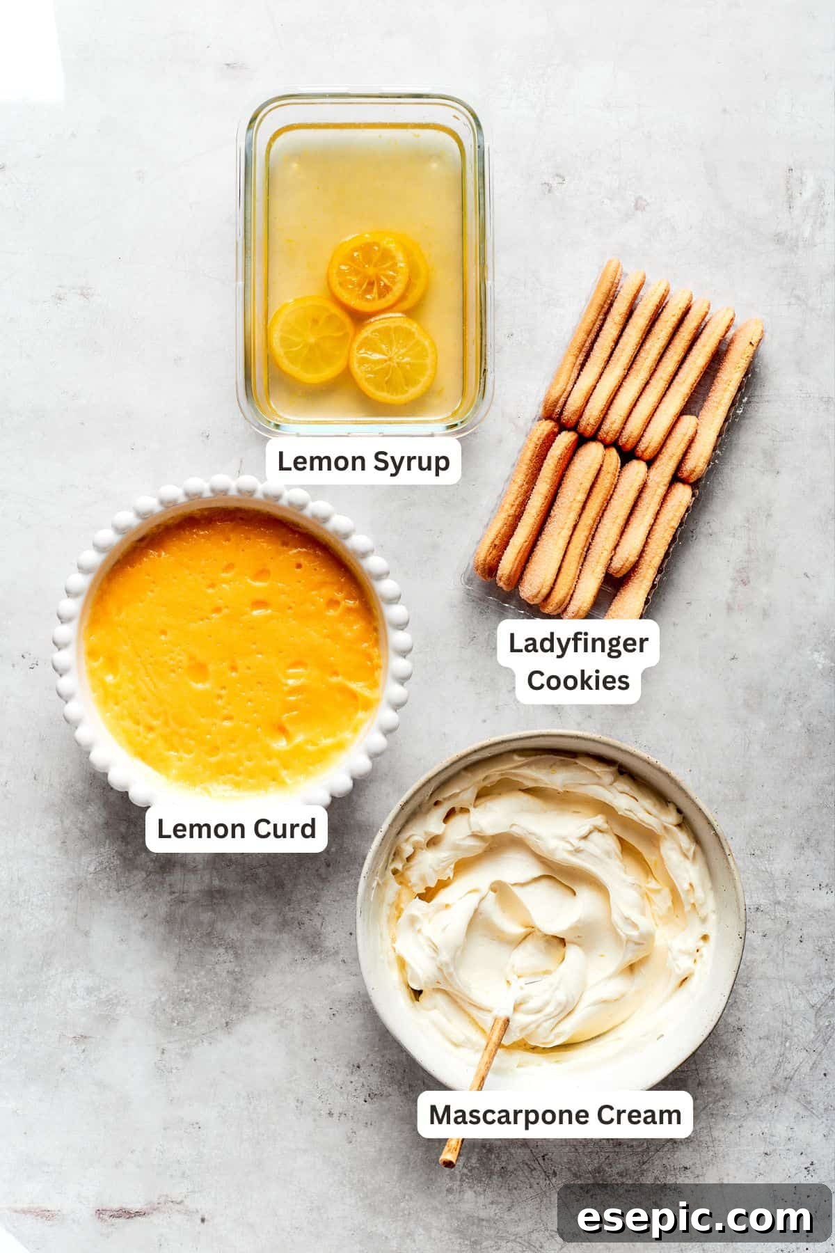 Lemon tiramisu ingredients: ladyfinger cookies, lemon curd, mascarpone filling, lemon syrup for assembly.