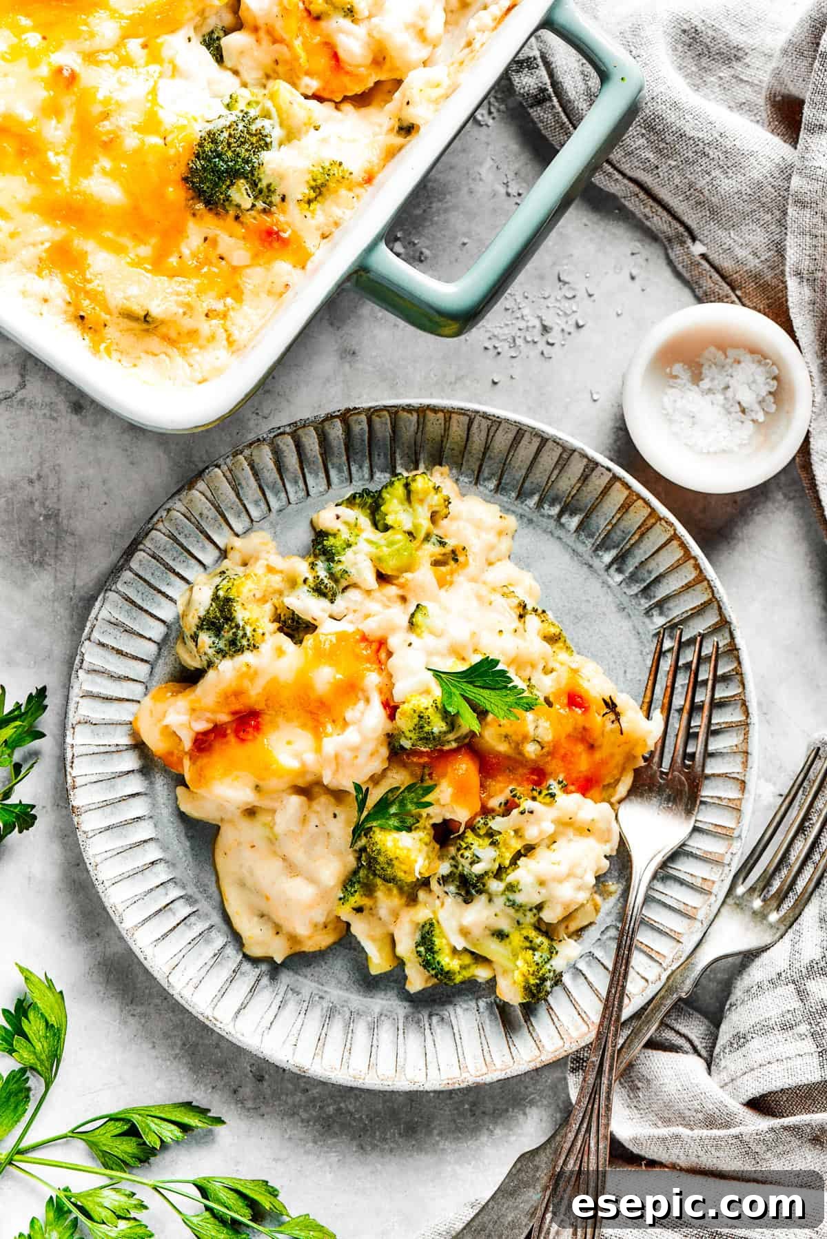 A beautifully presented serving of broccoli rice casserole on a dinner plate, ready to be enjoyed.