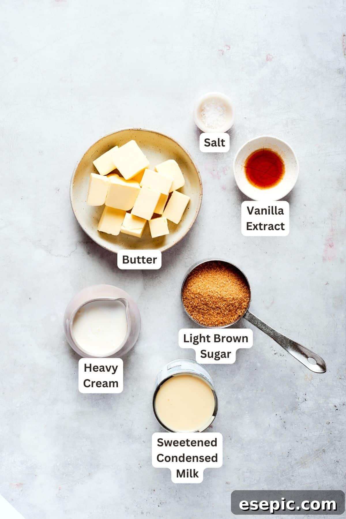 Millionaire Bars are decadent layers of homemade buttery shortbread, creamy caramel, and thick chocolate ganache. Labeled ingredients for the caramel layer: butter, vanilla extract, light brown sugar, salt, heavy cream, sweetened condensed milk.