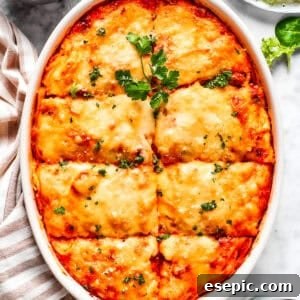 Overhead image of baked million dollar spaghetti in a casserole dish.