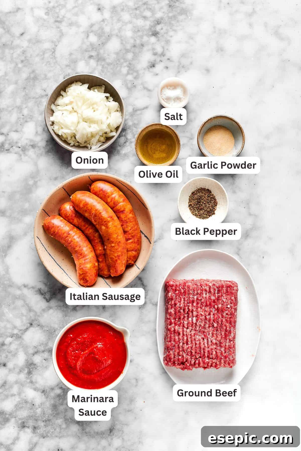 Key ingredients for million dollar spaghetti laid out, including pasta, ground meat, sauce, and various cheeses.