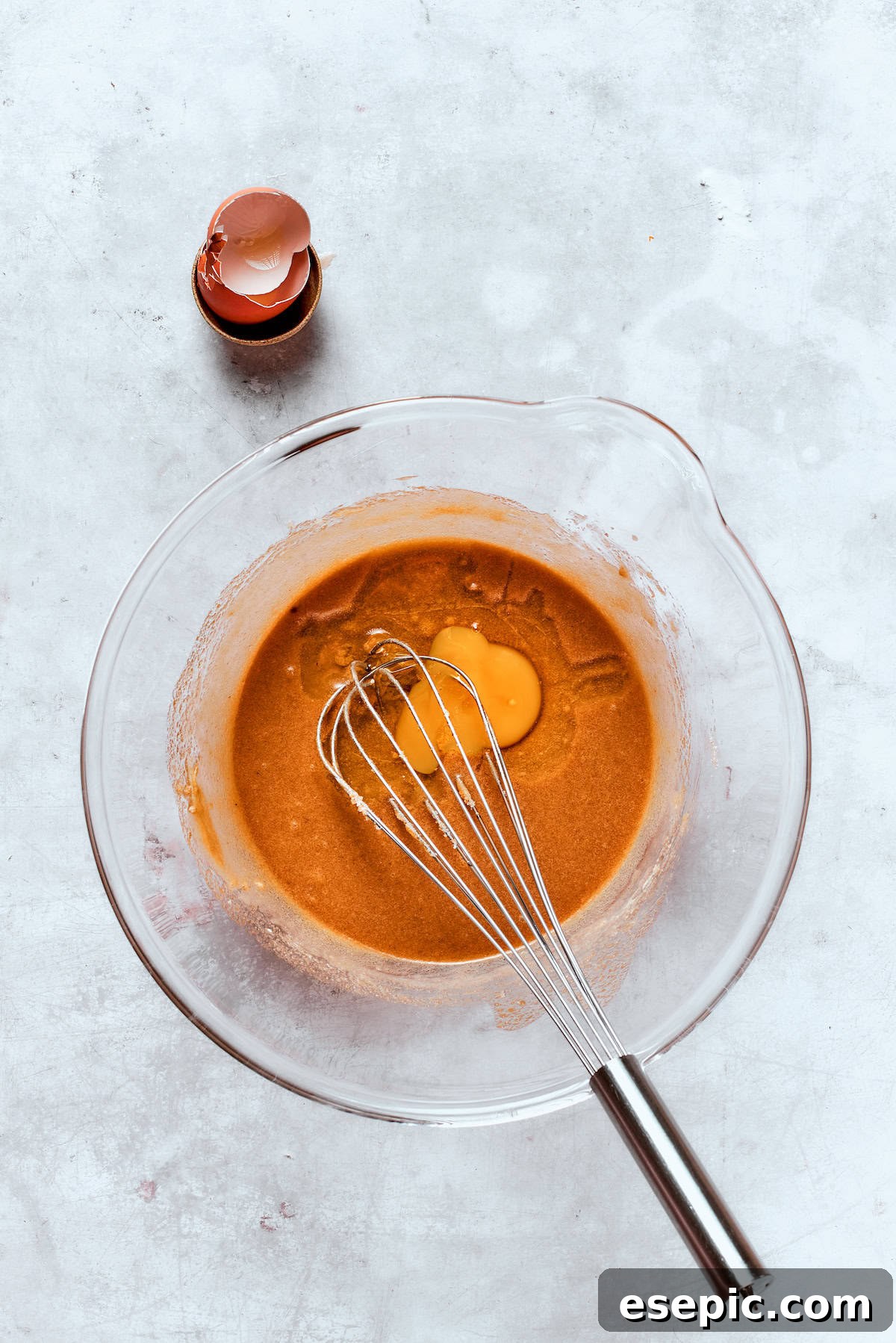 Baked not fried apple cider donuts are perfectly tender, dusted with spiced sugar, and fragrant with sweet apple cider. An egg and reduced apple cider are whisked into the main batter mixture, blending the wet ingredients.
