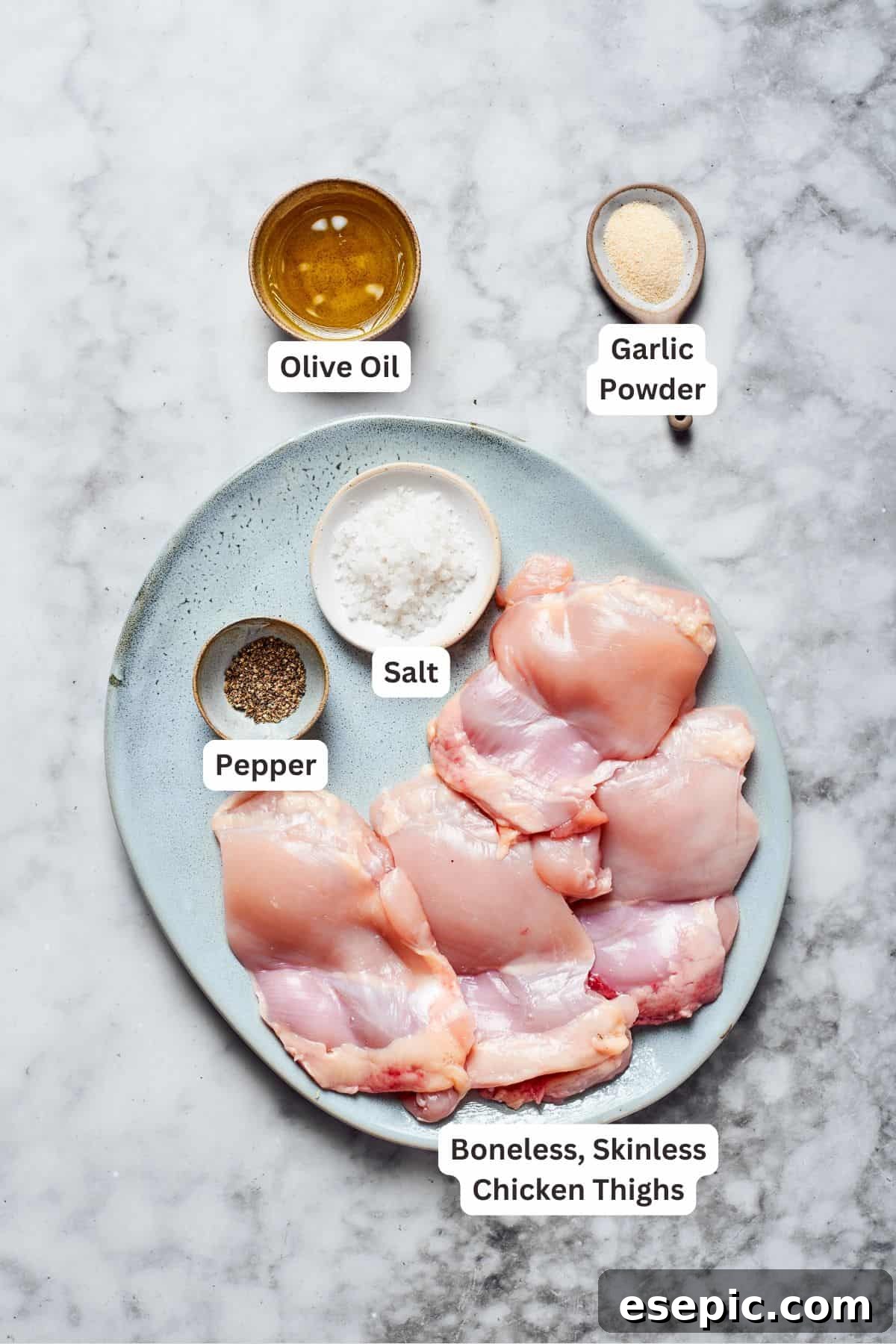 Creamy Garlic Parmesan Chicken Pasta 3 Key ingredients for preparing flavorful roasted chicken, neatly arranged on a counter.