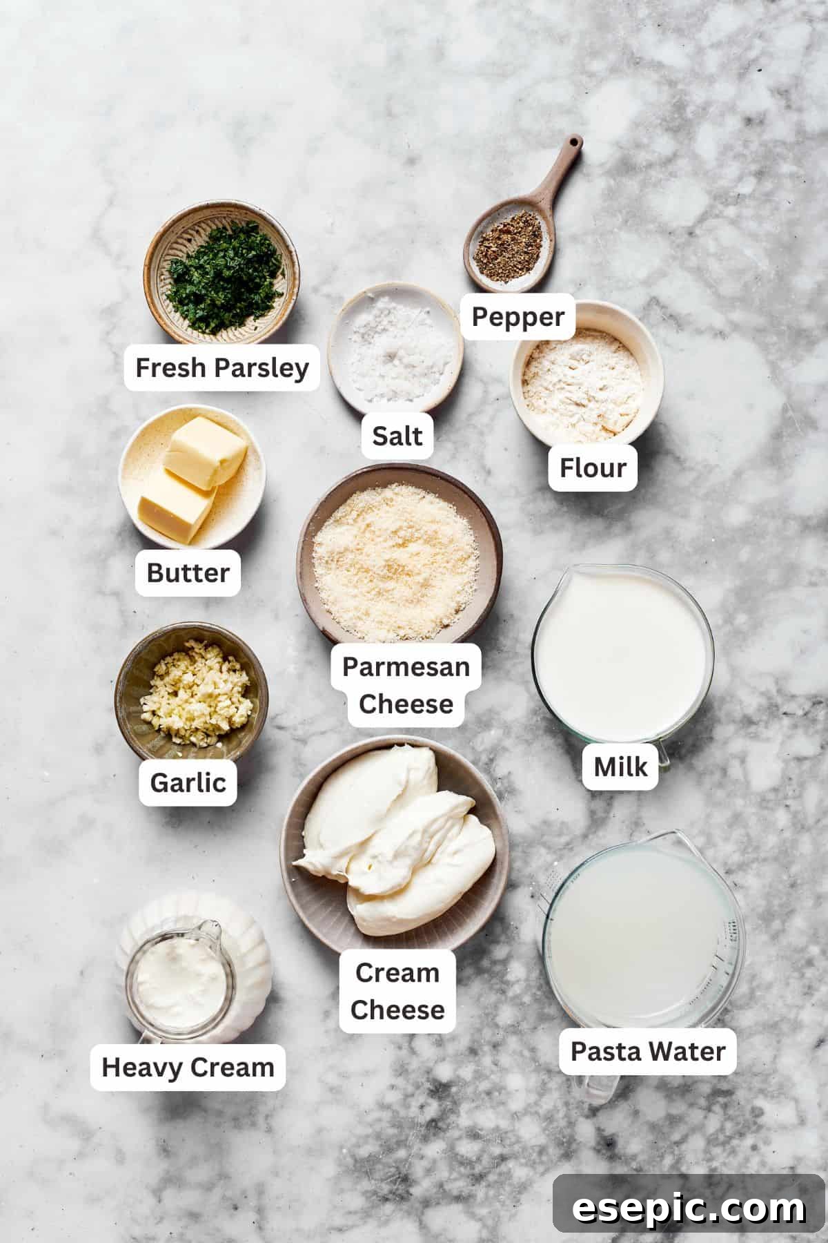 Creamy Garlic Parmesan Chicken Pasta 4 Essential ingredients for creating the rich garlic parmesan sauce, laid out for easy viewing.