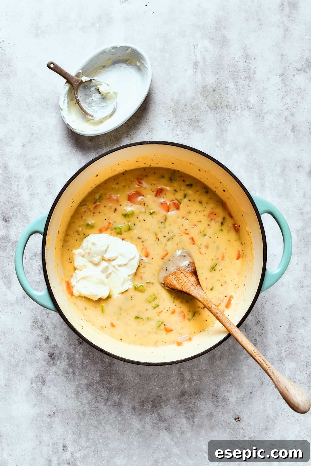 Chicken pot pie casserole is everything you love about the classic comfort food, baked under fluffy buttermilk biscuits instead of pie crust! Adding softened cream cheese to the pot pie filling, which will melt into a luxurious, smooth sauce.
