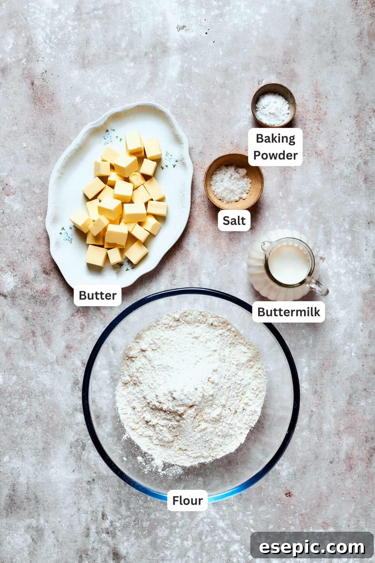 Cozy Chicken Pot Pie Casserole Recipe Ingredients for homemade buttermilk biscuits, including butter, flour, baking powder, salt, and buttermilk, neatly arranged on a counter.