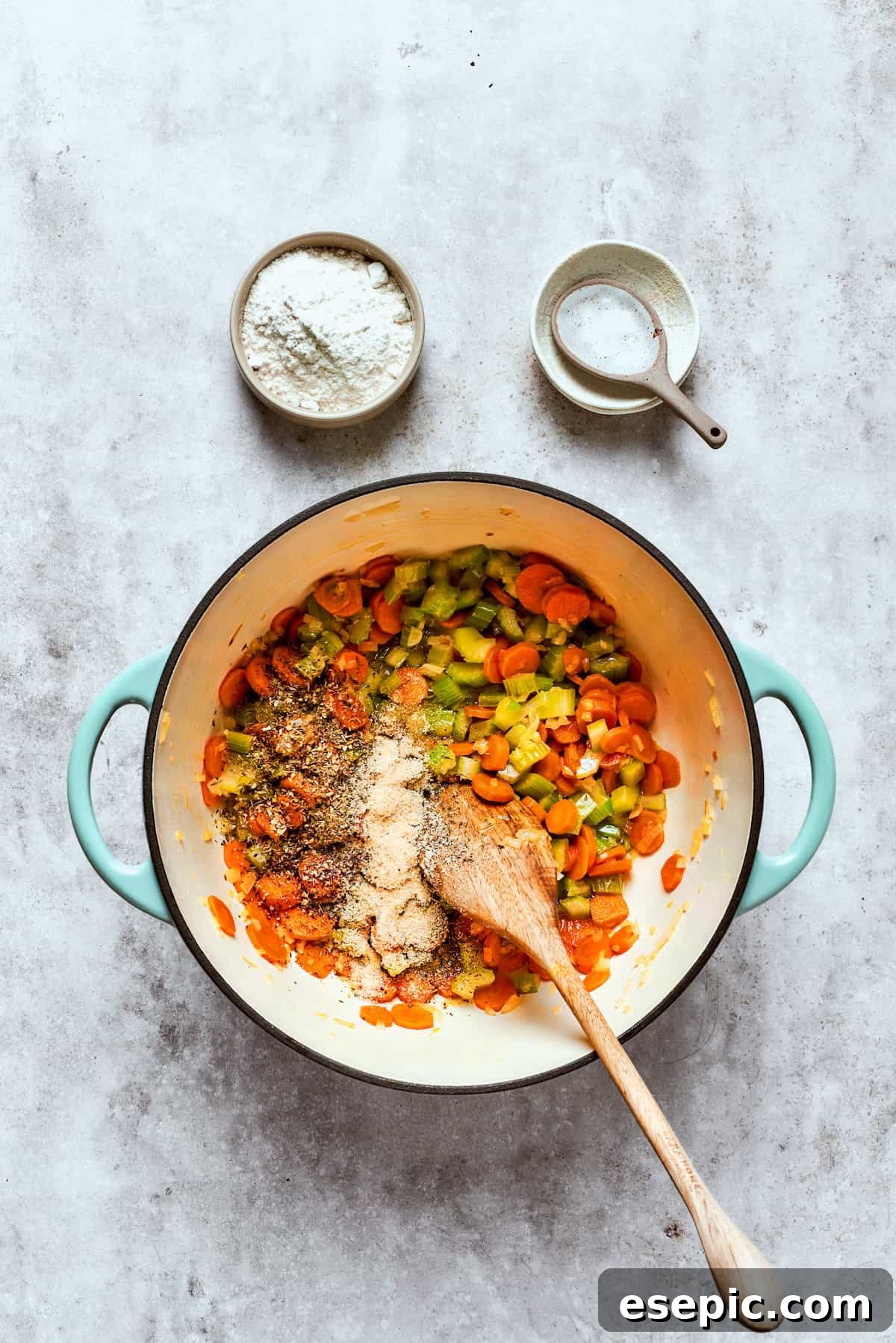 Chicken pot pie casserole is everything you love about the classic comfort food, baked under fluffy buttermilk biscuits instead of pie crust! Sautéing diced carrots, onions, and celery in a large pot with melted butter, seasoned with salt.