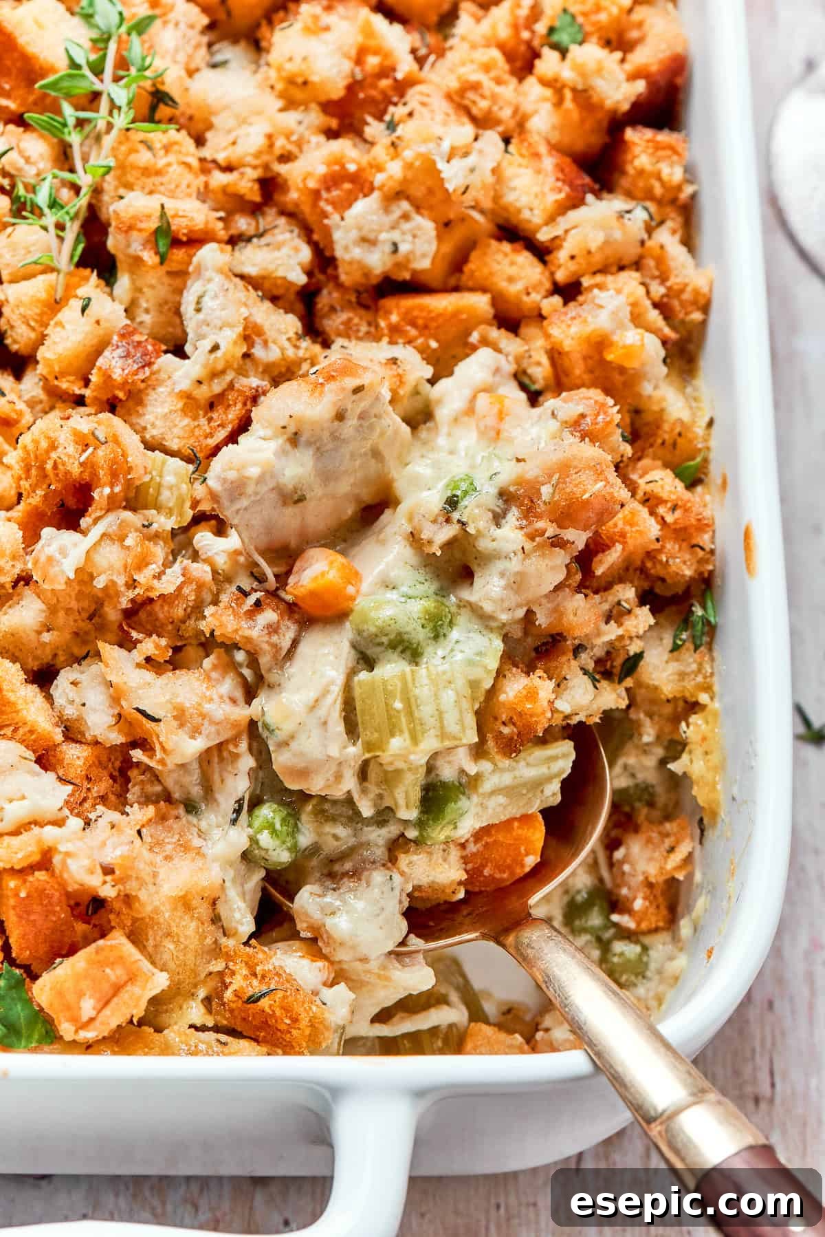 Golden brown chicken stuffing casserole in a large baking dish, ready to be served.